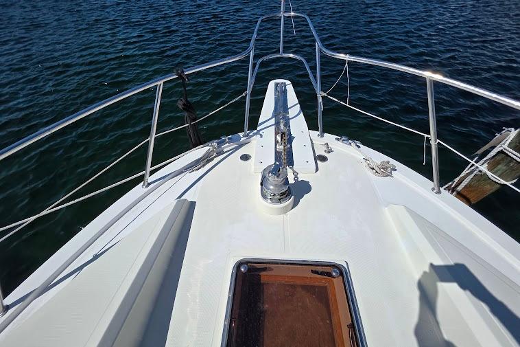 Bow view of 1993 McKinna 48 Pilothouse yacht on water.