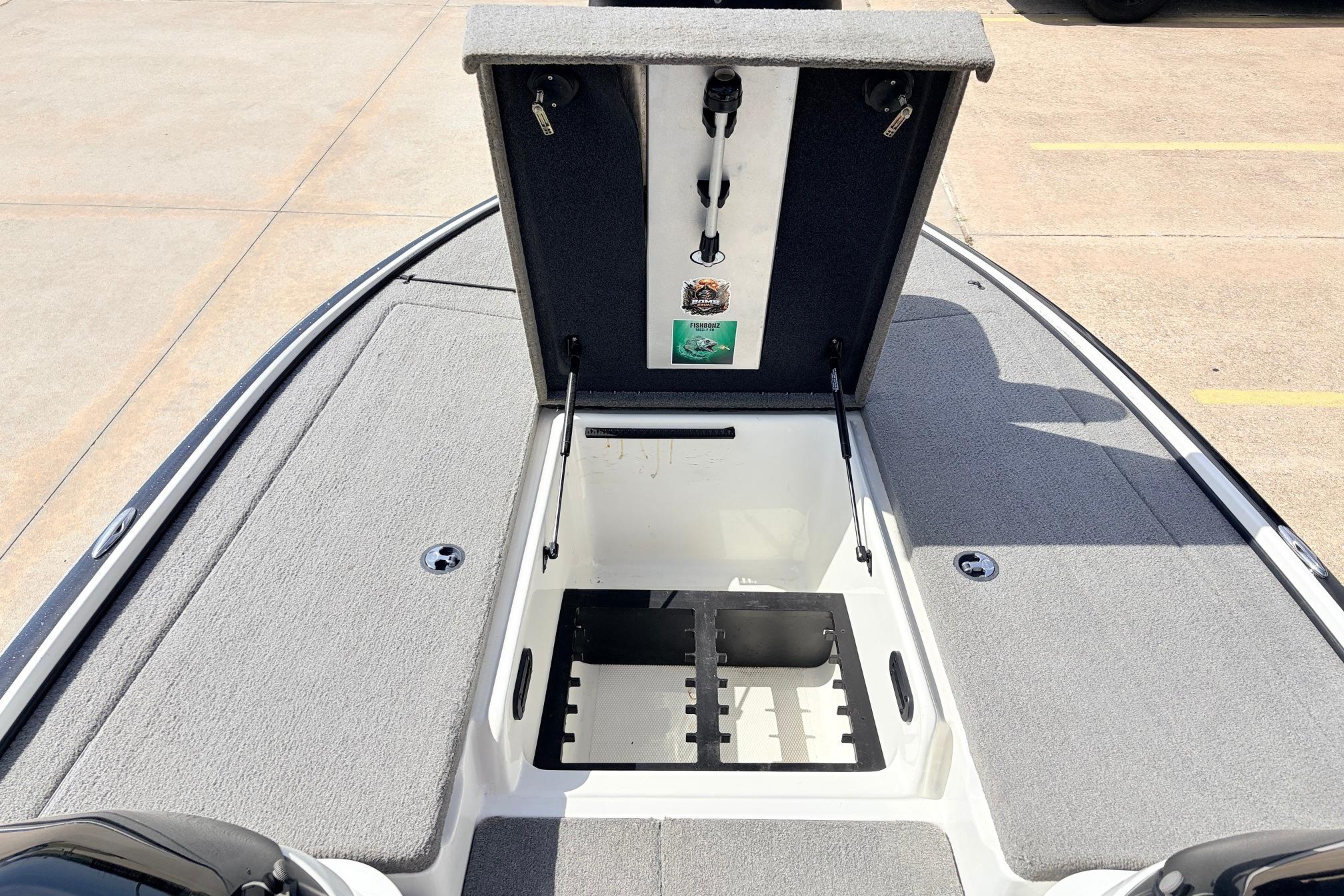 Open storage compartment on a 2011 Nitro Z-7 boat, showcasing interior features.