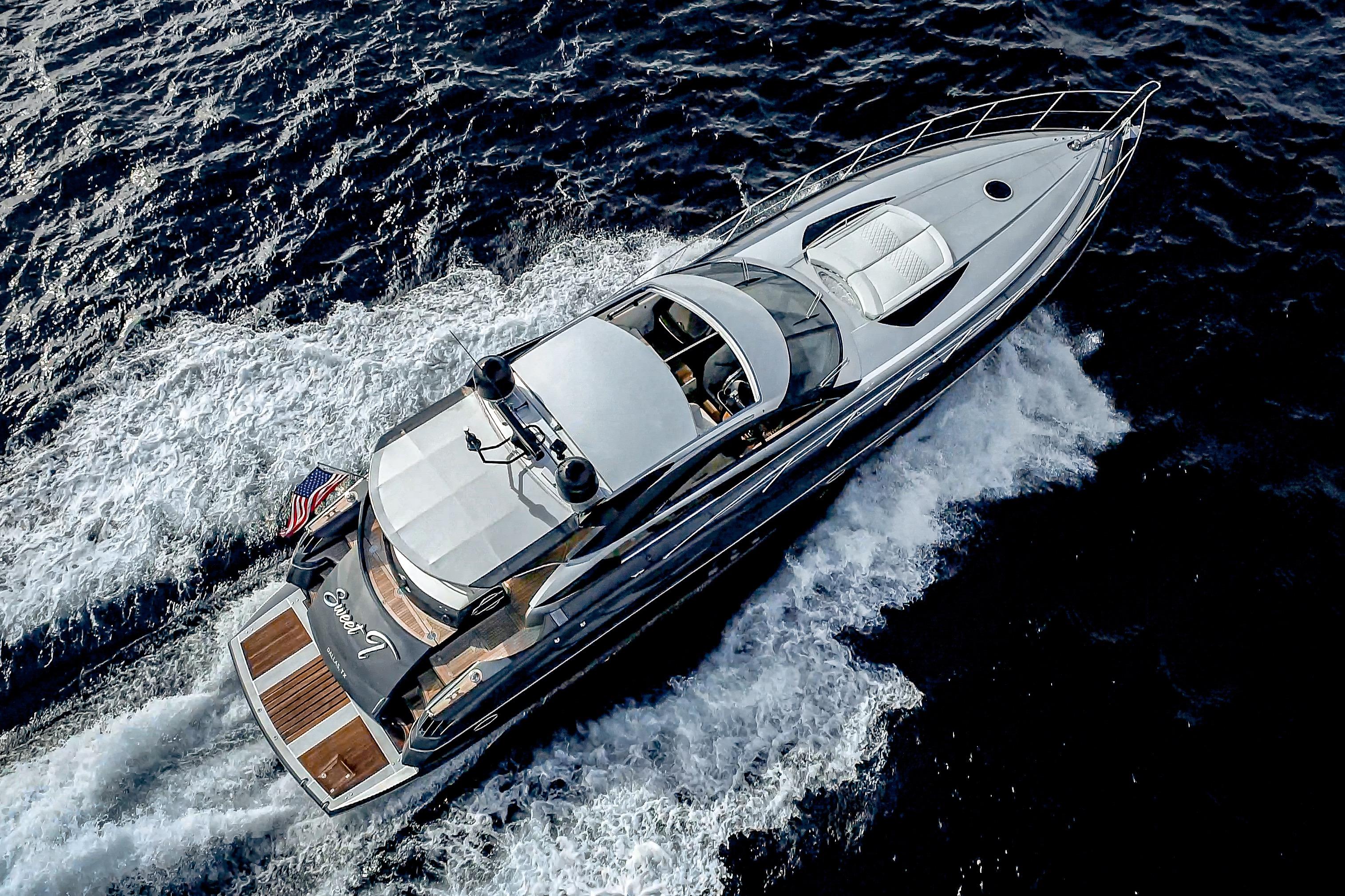 Aerial view of 2021 Sunseeker Predator 68 yacht cruising on the ocean.