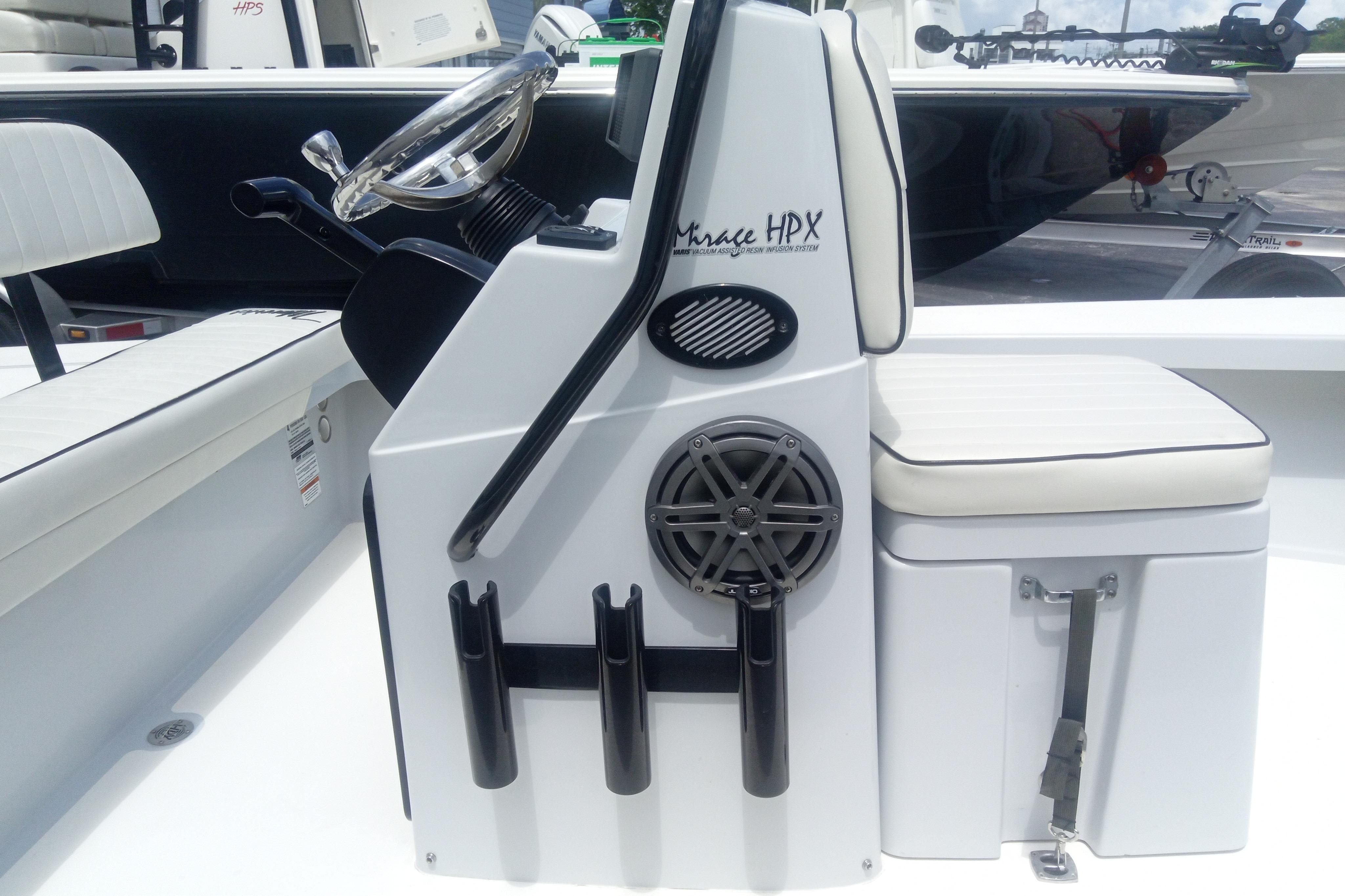 2020 Maverick 18 HPX-V boat console with steering wheel, rod holders, and cushioned seating.