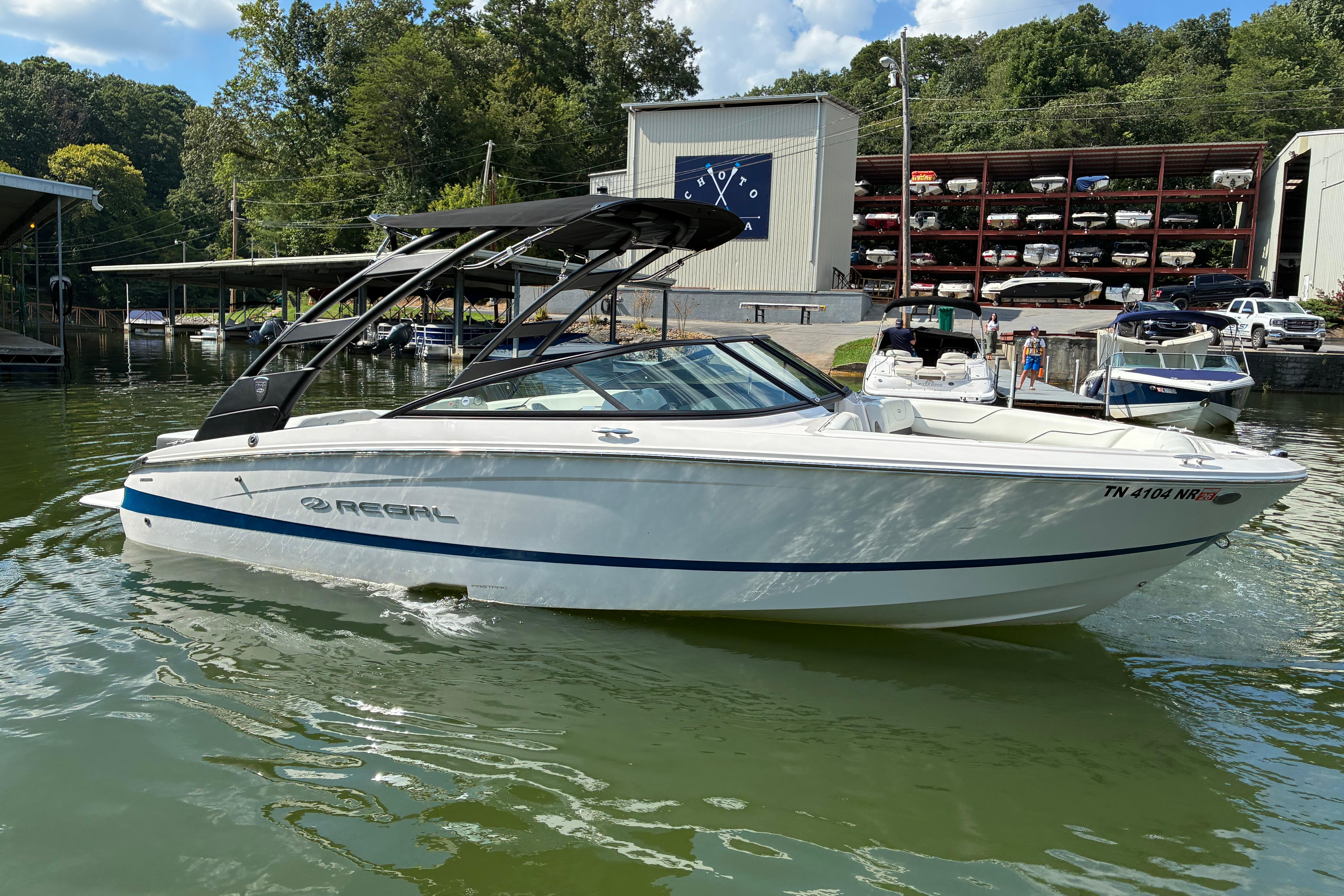 2025 Regal LS2 boat docked on a sunny day at a marina.