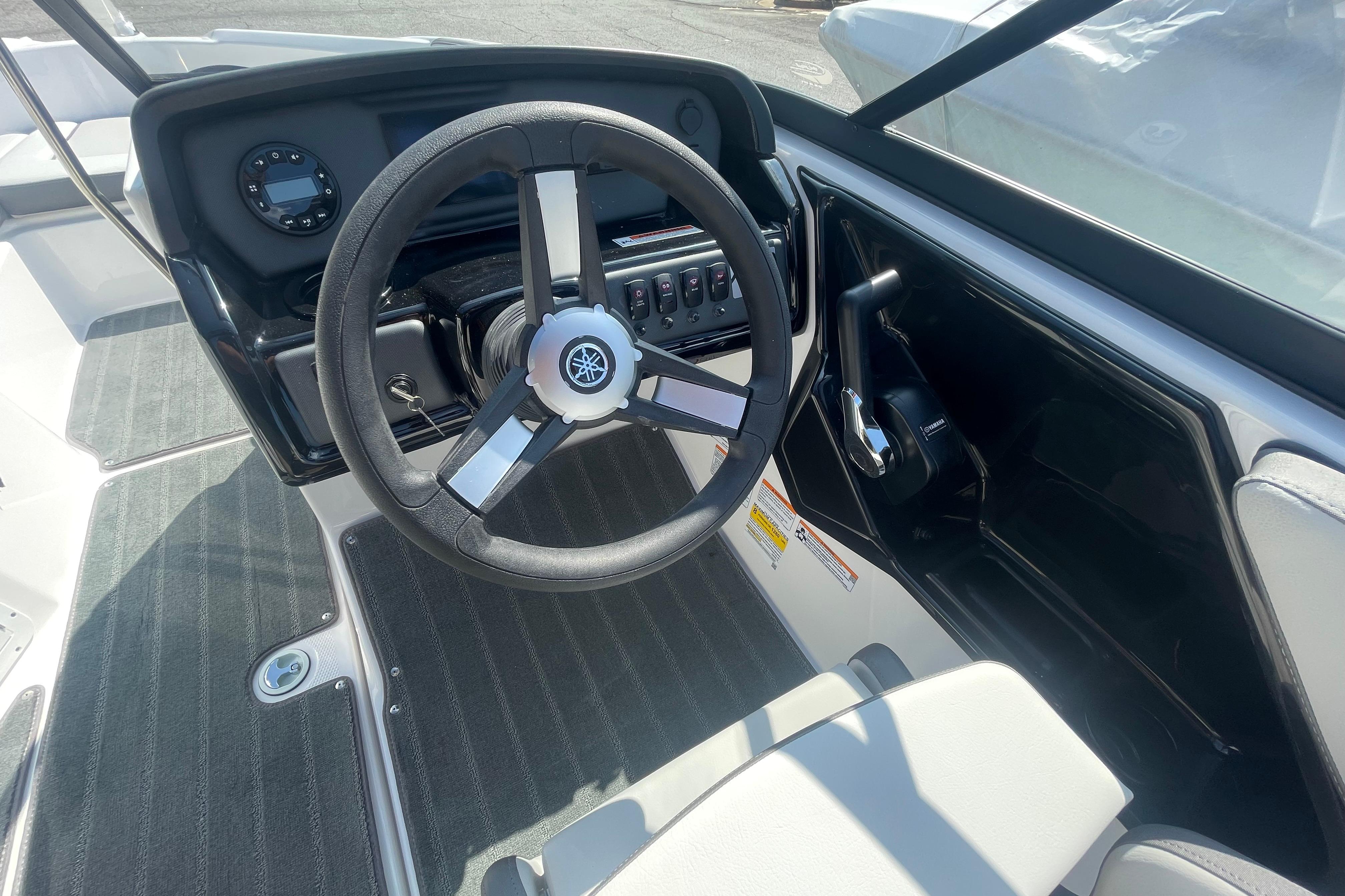 2026 Yamaha AR190 boat cockpit with steering wheel and control panel.