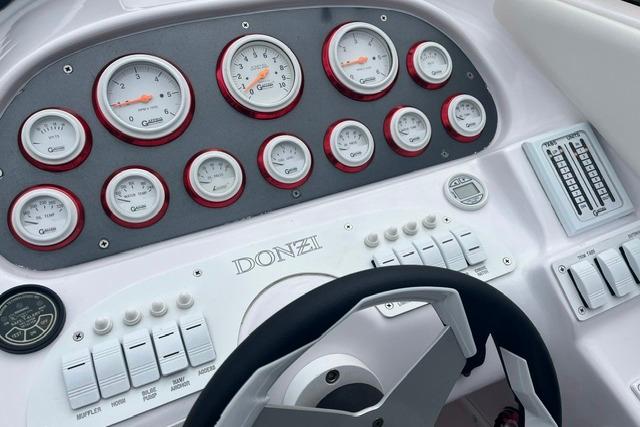 Dashboard of a 2000 Donzi 33 ZX boat with gauges and controls.
