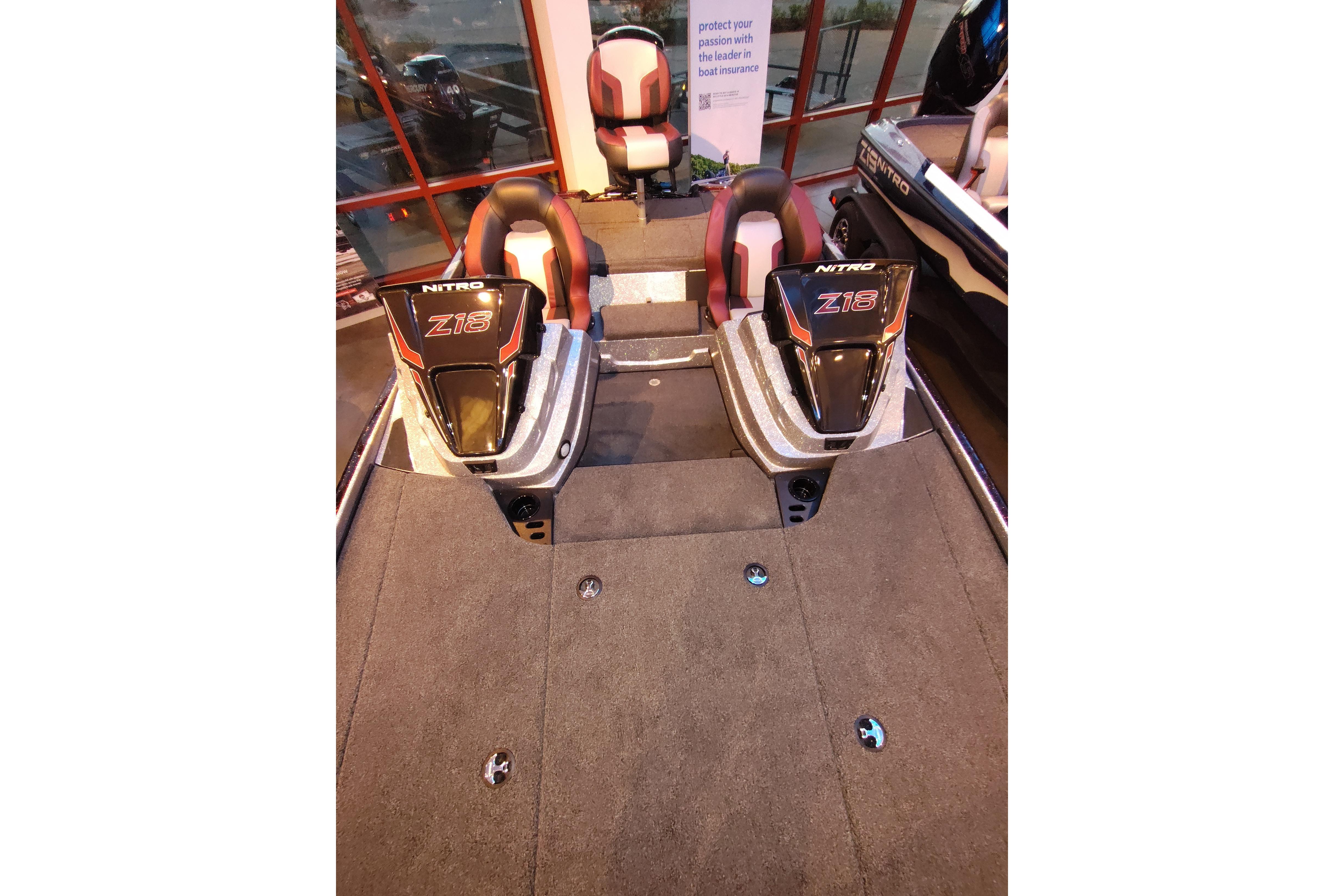 2026 Nitro Z18 boat interior with dual seats and carpeted deck.