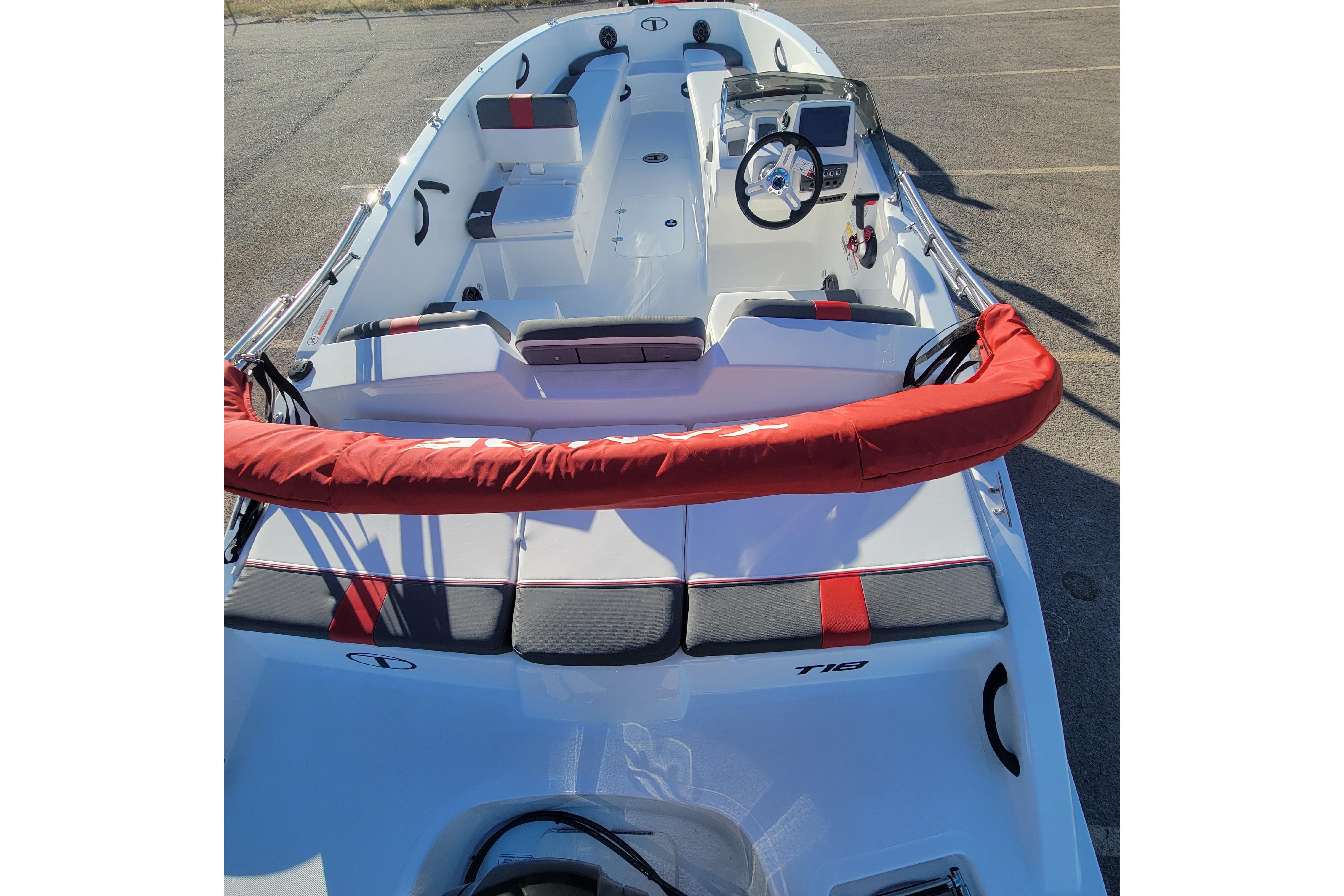 2026 Tahoe T18 boat interior with red accents and modern steering console.