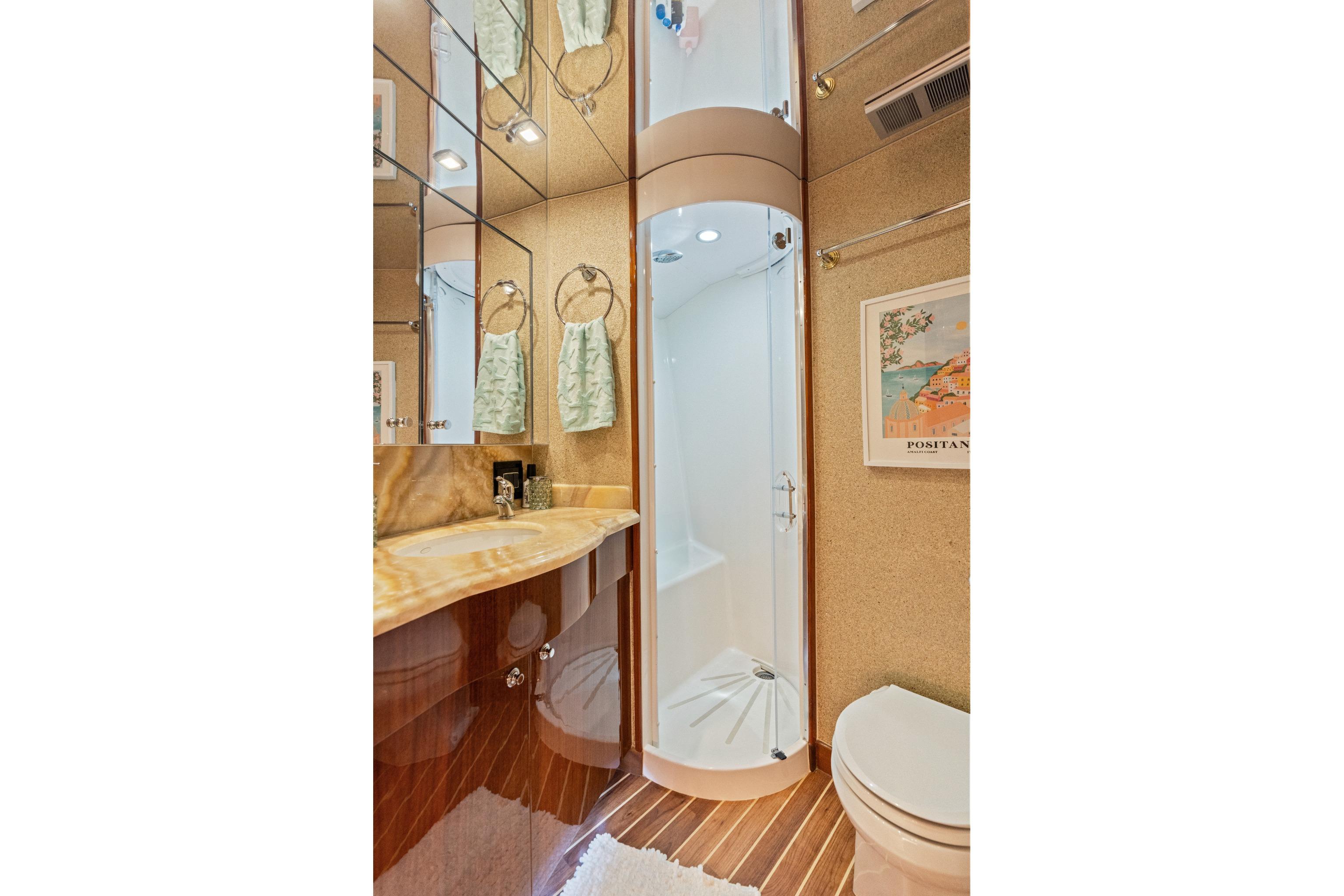 Luxurious bathroom in 2008 Hatteras 64 Motor Yacht with elegant fixtures and modern design.