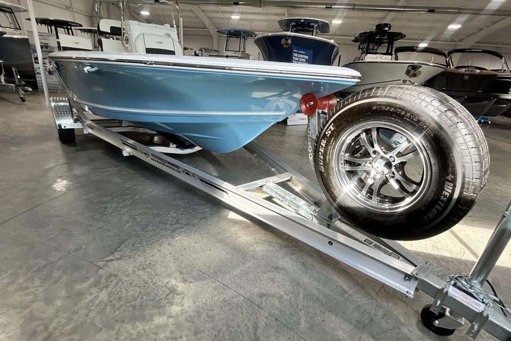 2026 Tidewater 1910 Bay Max boat on trailer in showroom.