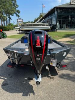 Ranger RT198P 2025 boat with 150 HP motor, parked outdoors.