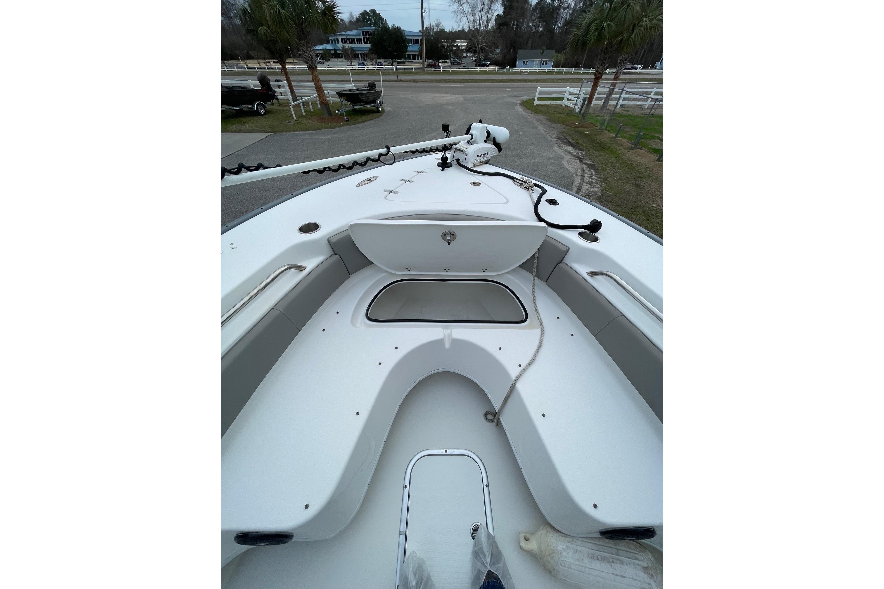 2023 Cape Horn 24 XS boat deck with seating and storage compartments.