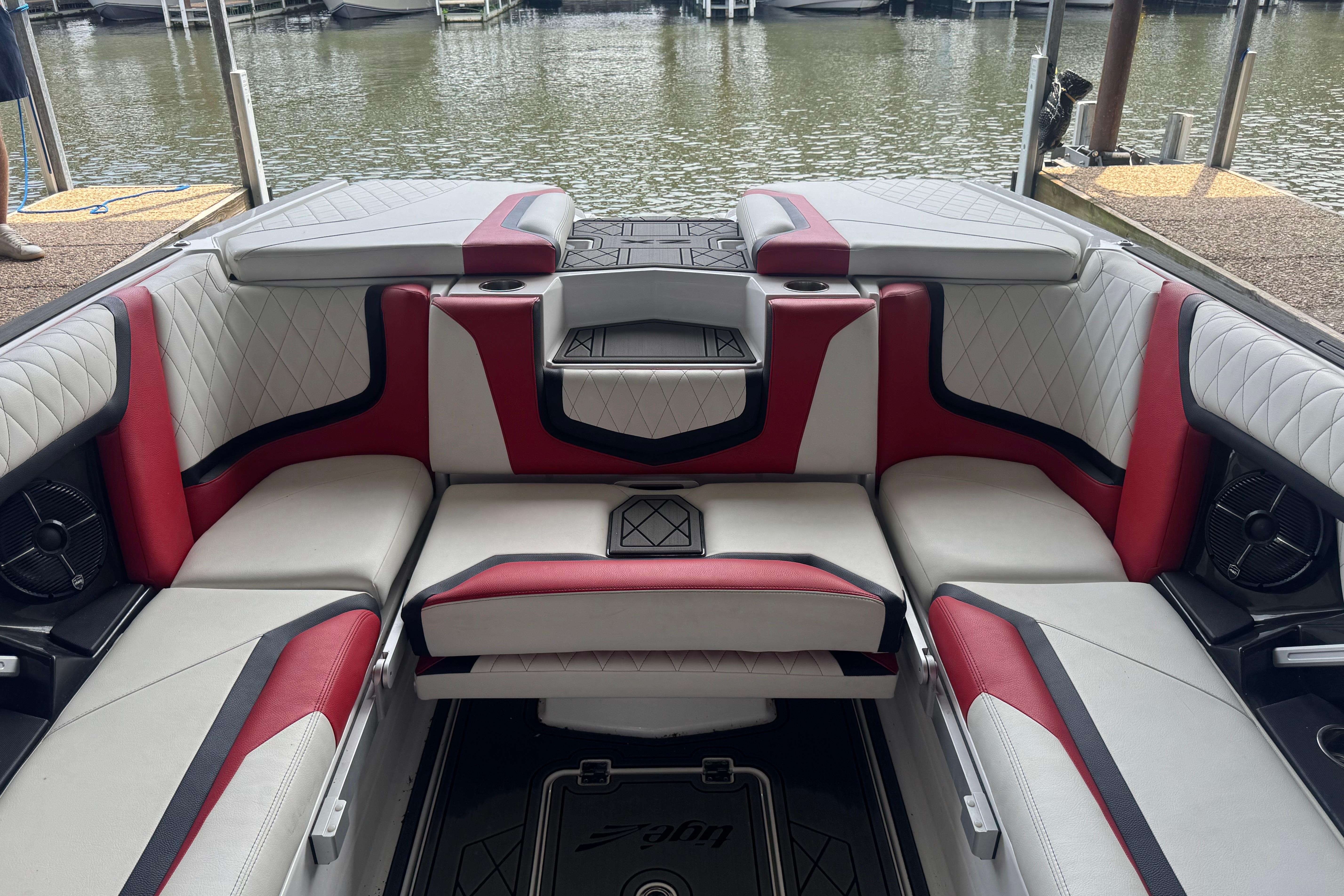 2020 Tige 25ZX boat interior with red and white seating, docked by the water.