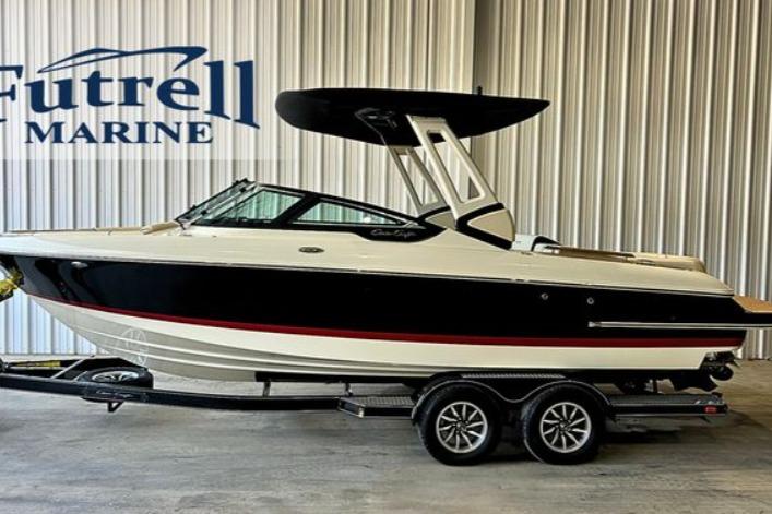 2025 Chris-Craft Sportster 25 boat on trailer at Futrell Marine showroom.