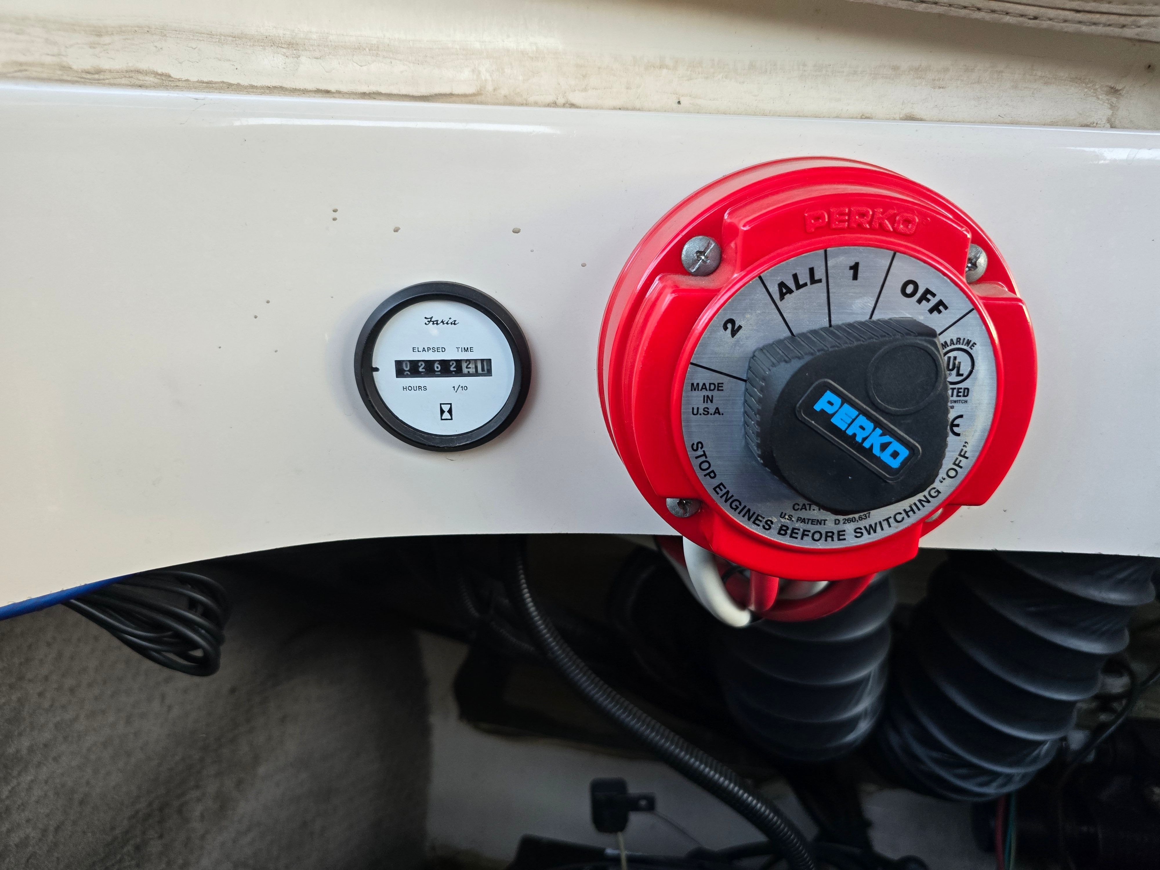 Boat control panel with Perko switch and hour meter, Larson LXI 2001.