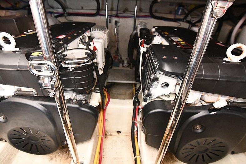Engine room of a 2008 Carver 43 Super Sport yacht, showcasing dual engines.