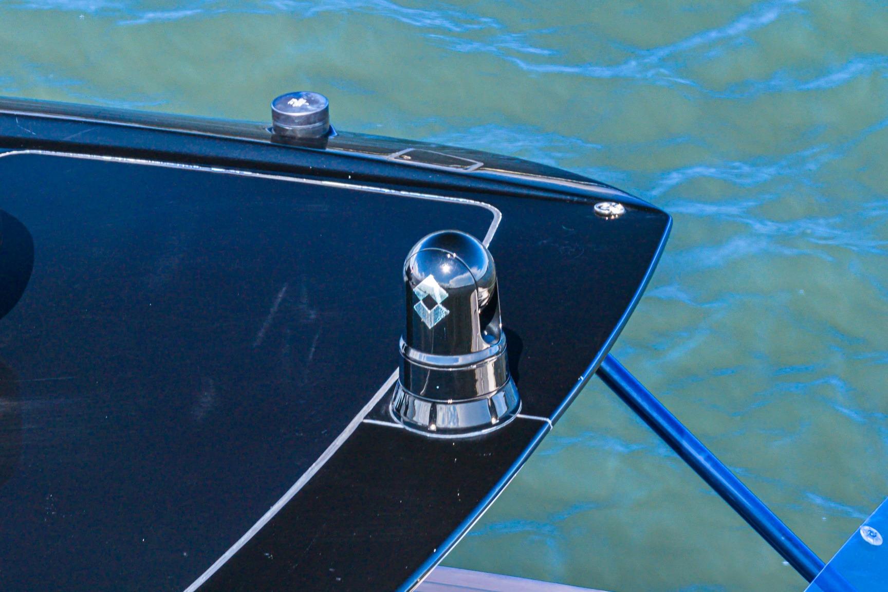 Close-up of 2023 Pardo Yachts 38 bow with chrome fixture, on water.