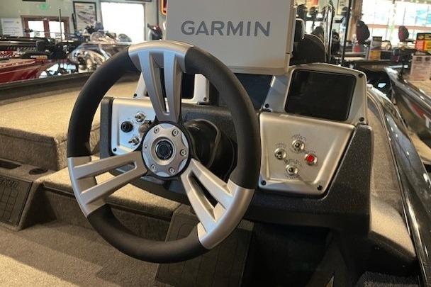 Steering wheel of 2025 Tracker Savage 215 boat with Garmin navigation system.