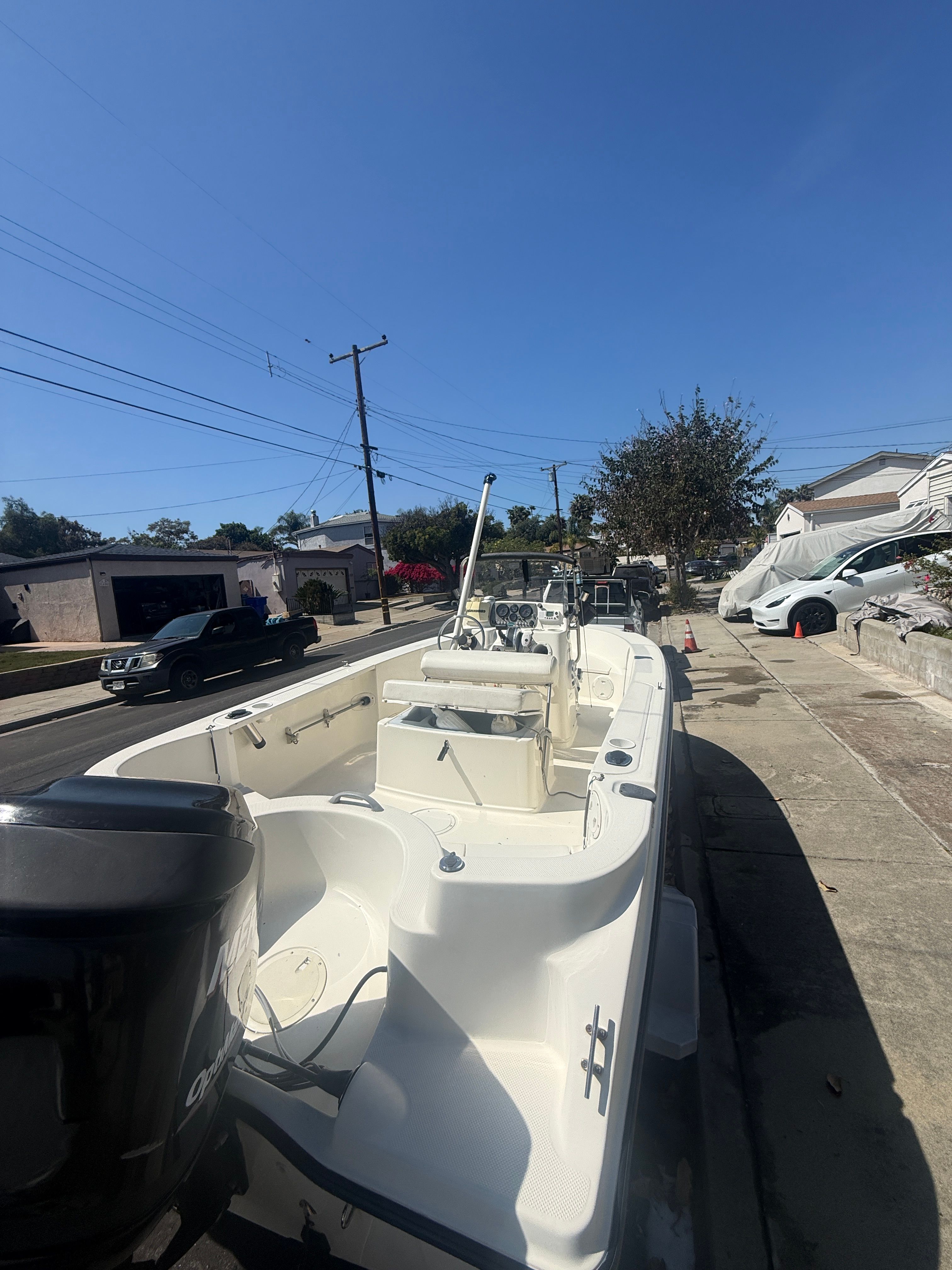 2008 Trophy 1703 Center Console boat parked on a street.