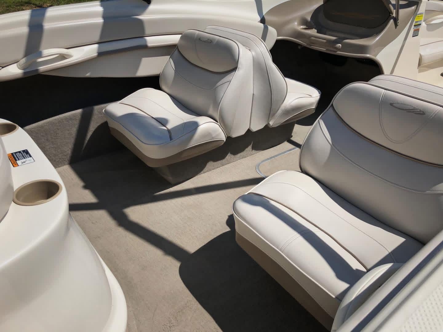 Interior of a 1999 Maxum 1800 SR boat with white seats.