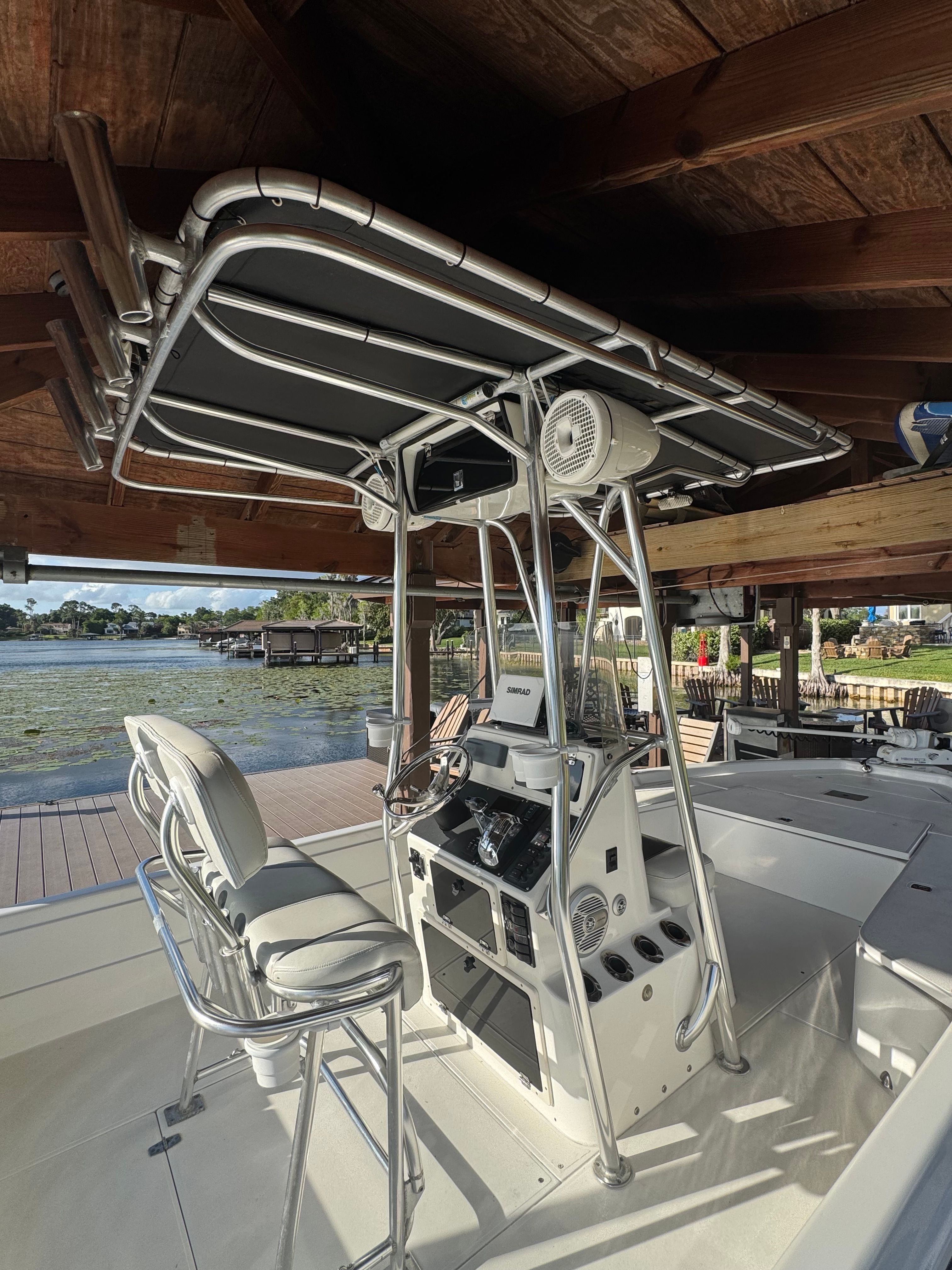 2004 ShearWater LTZ boat with helm console and seating at dock.