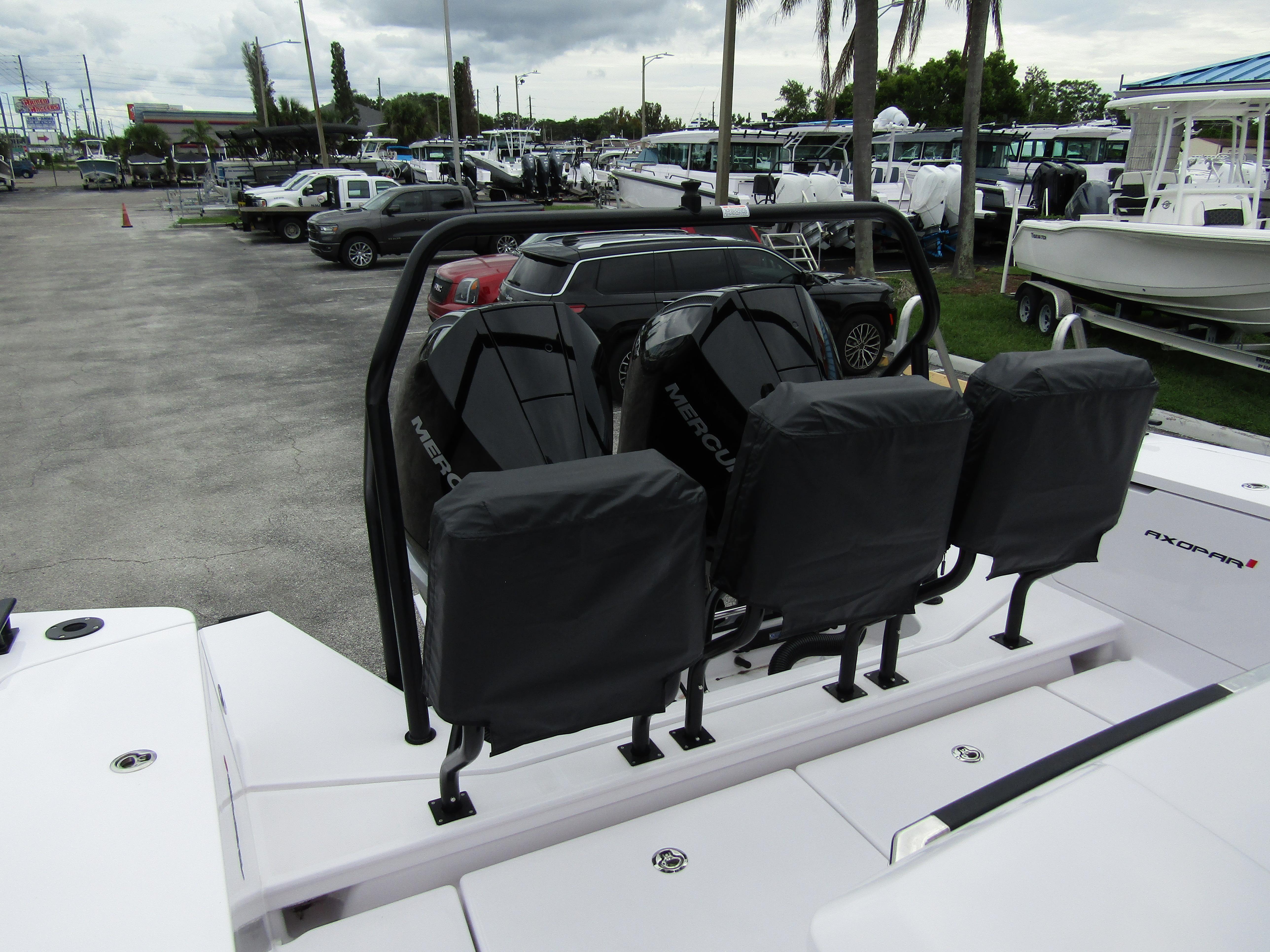 2024 Axopar 37XC CROSS CABIN with Mercury engines at a marina.