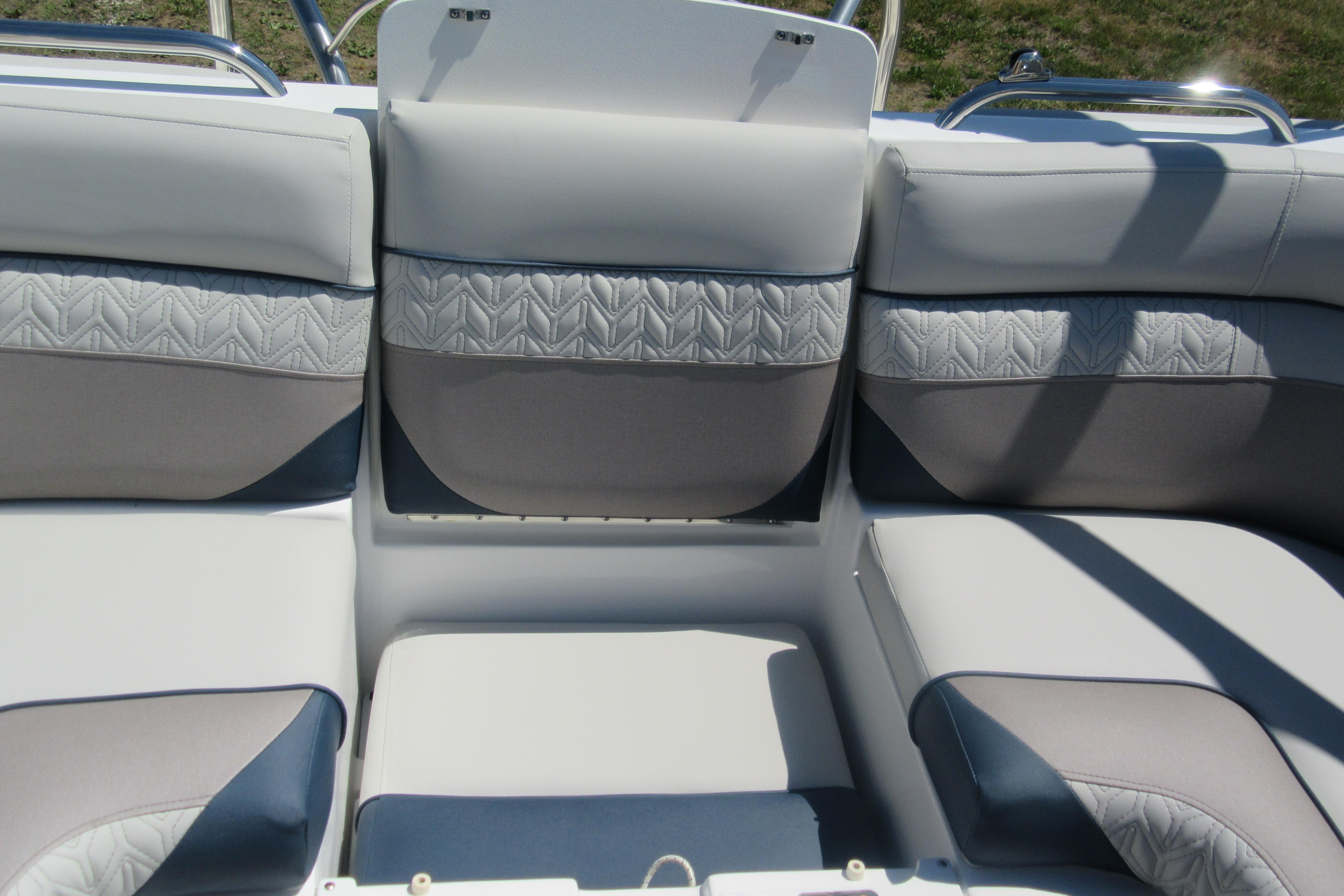 2027 Hurricane SunDeck 2486 OB boat interior with cushioned seating and elegant design.