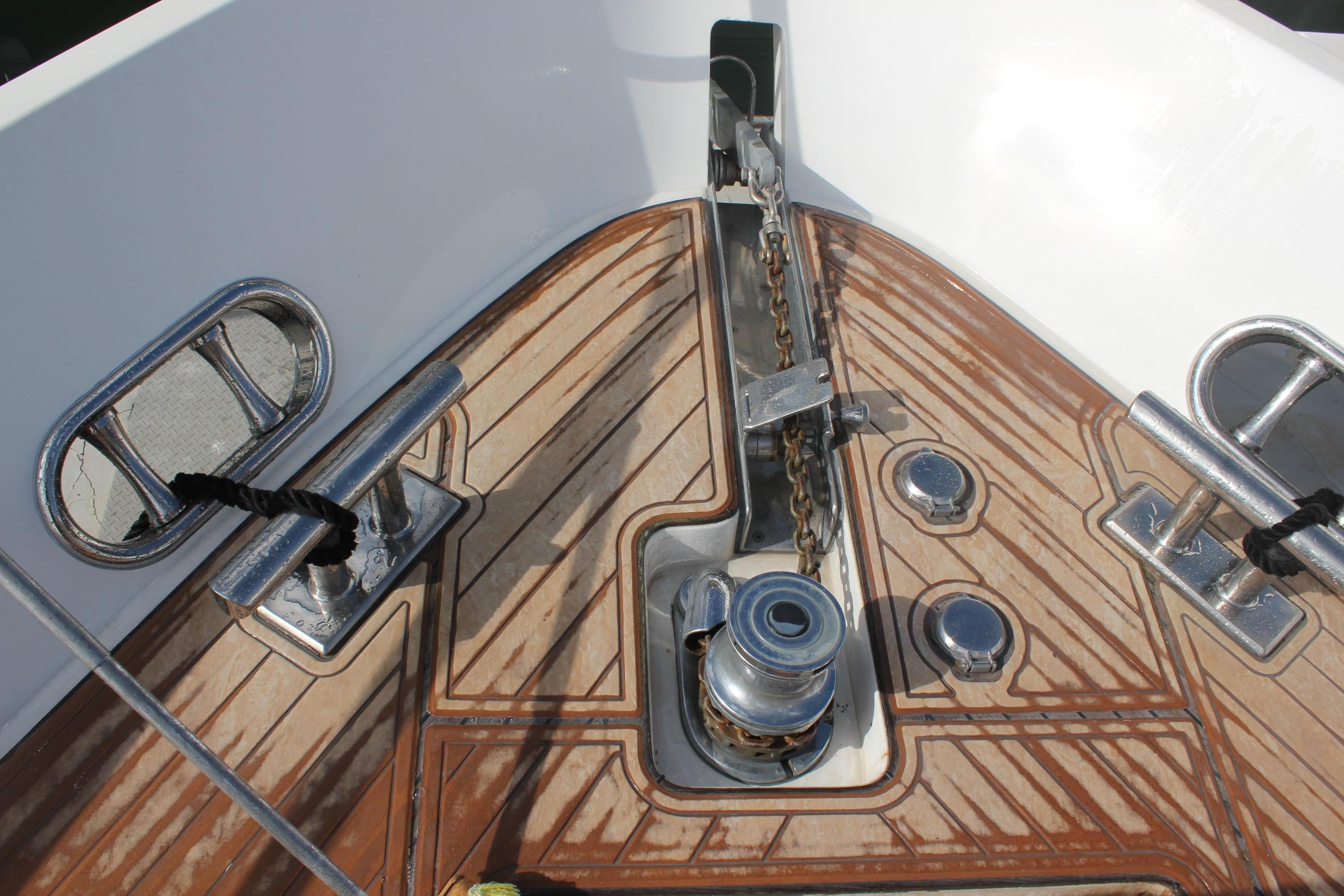 Anchor chain and winch on 1999 Horizon 70 Motor Yacht deck.