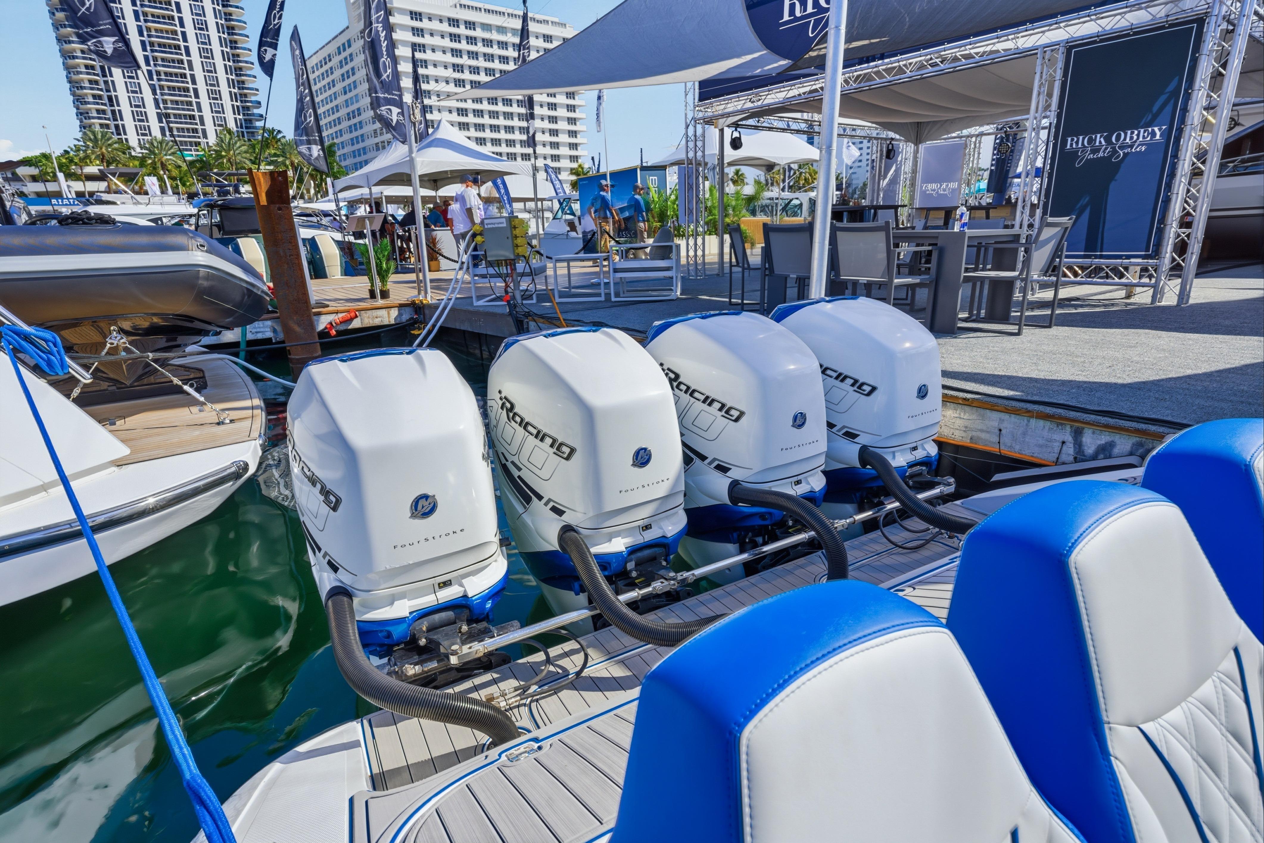 2019 Midnight Express 43 Open boat with powerful outboard engines at a marina display.