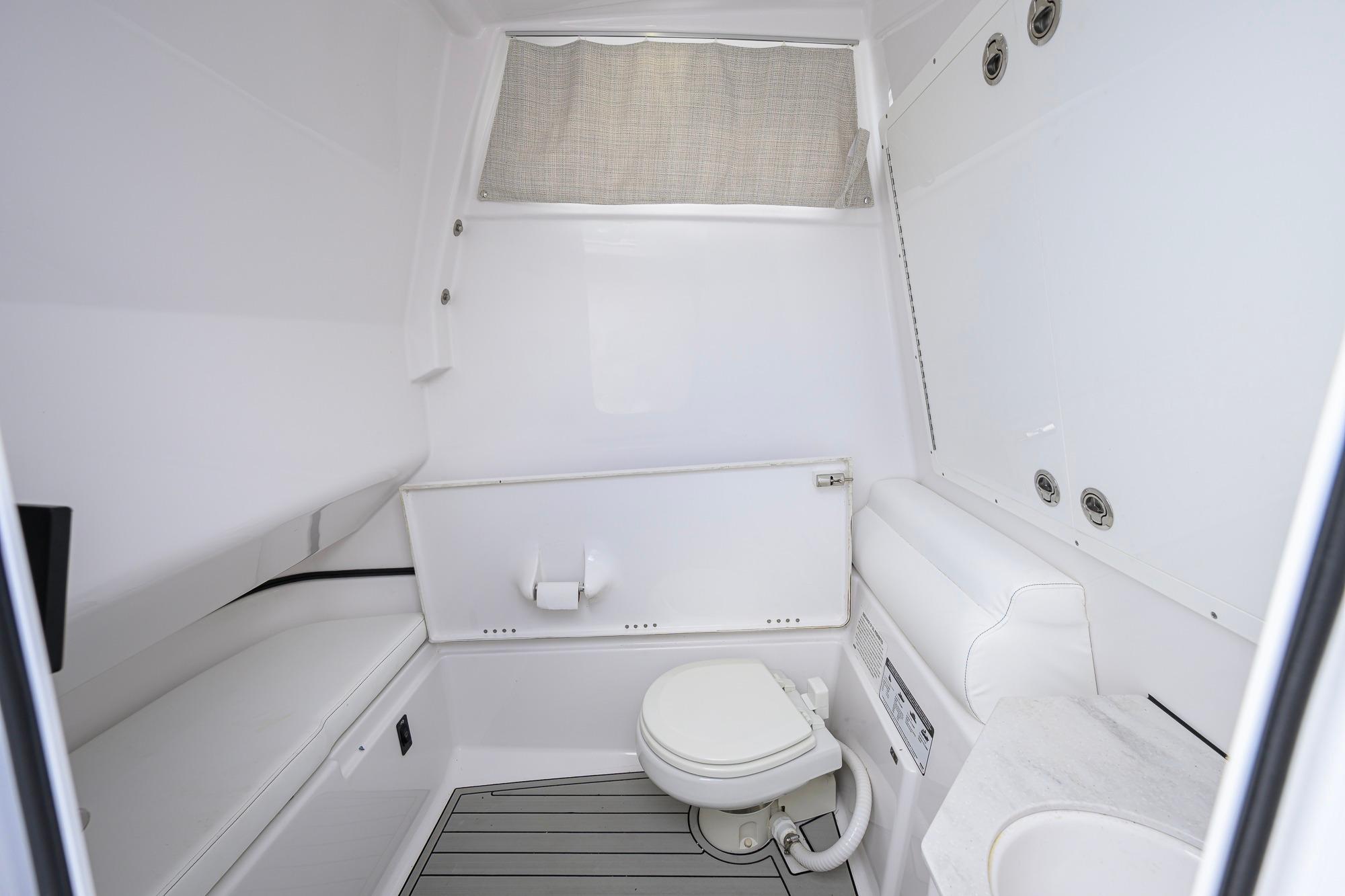 Interior of 2023 Sportsman Open 302 Center Console boat bathroom.