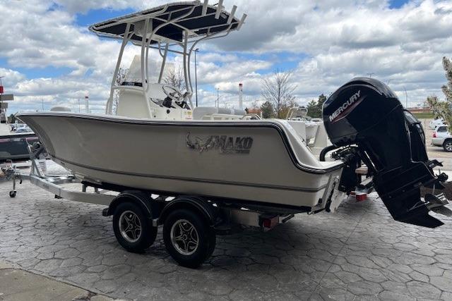 2026 Mako 214 Center Console boat with Mercury outboard motor on a trailer.