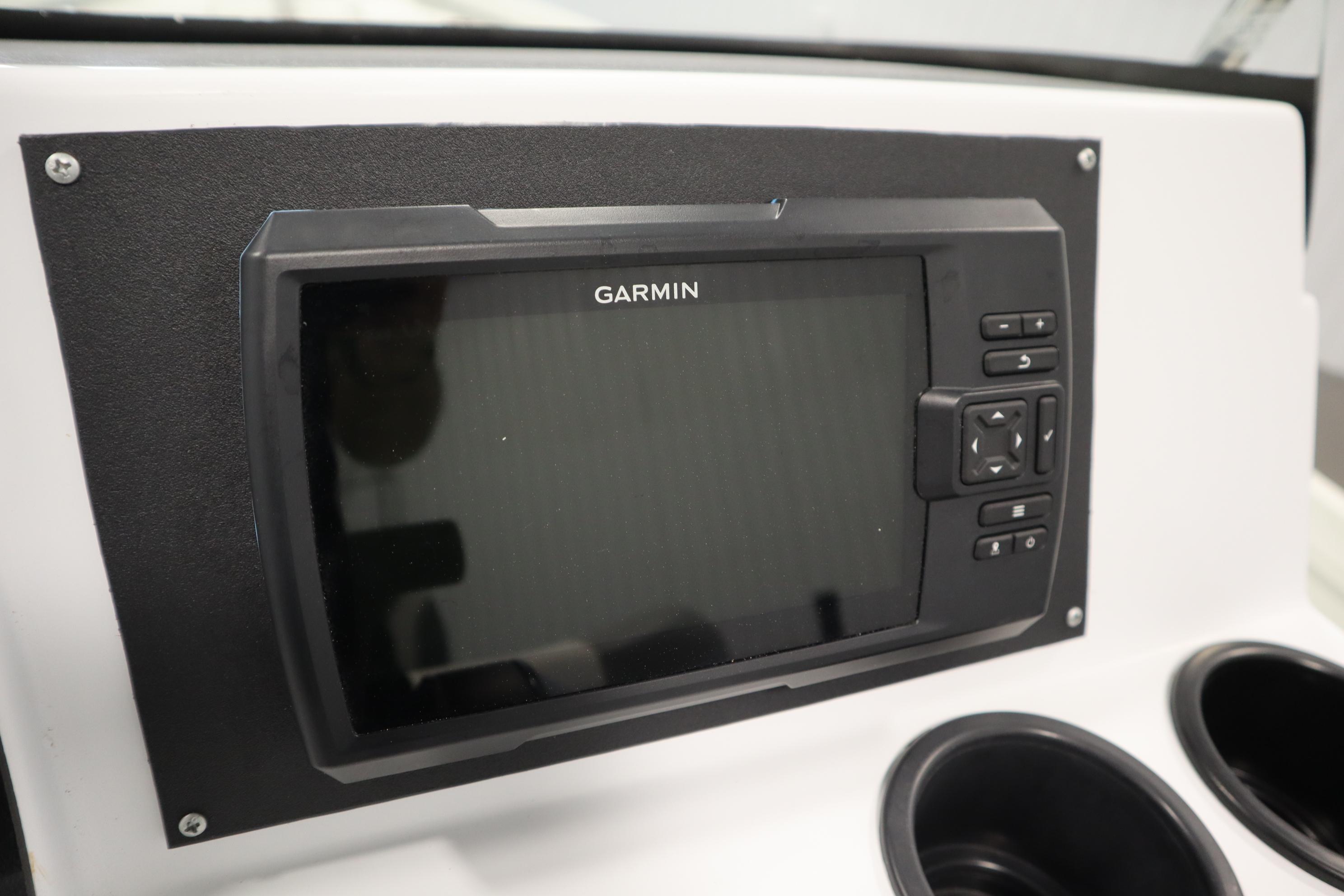 Garmin display on 2022 Crestliner 2200 CC boat dashboard with cup holders.