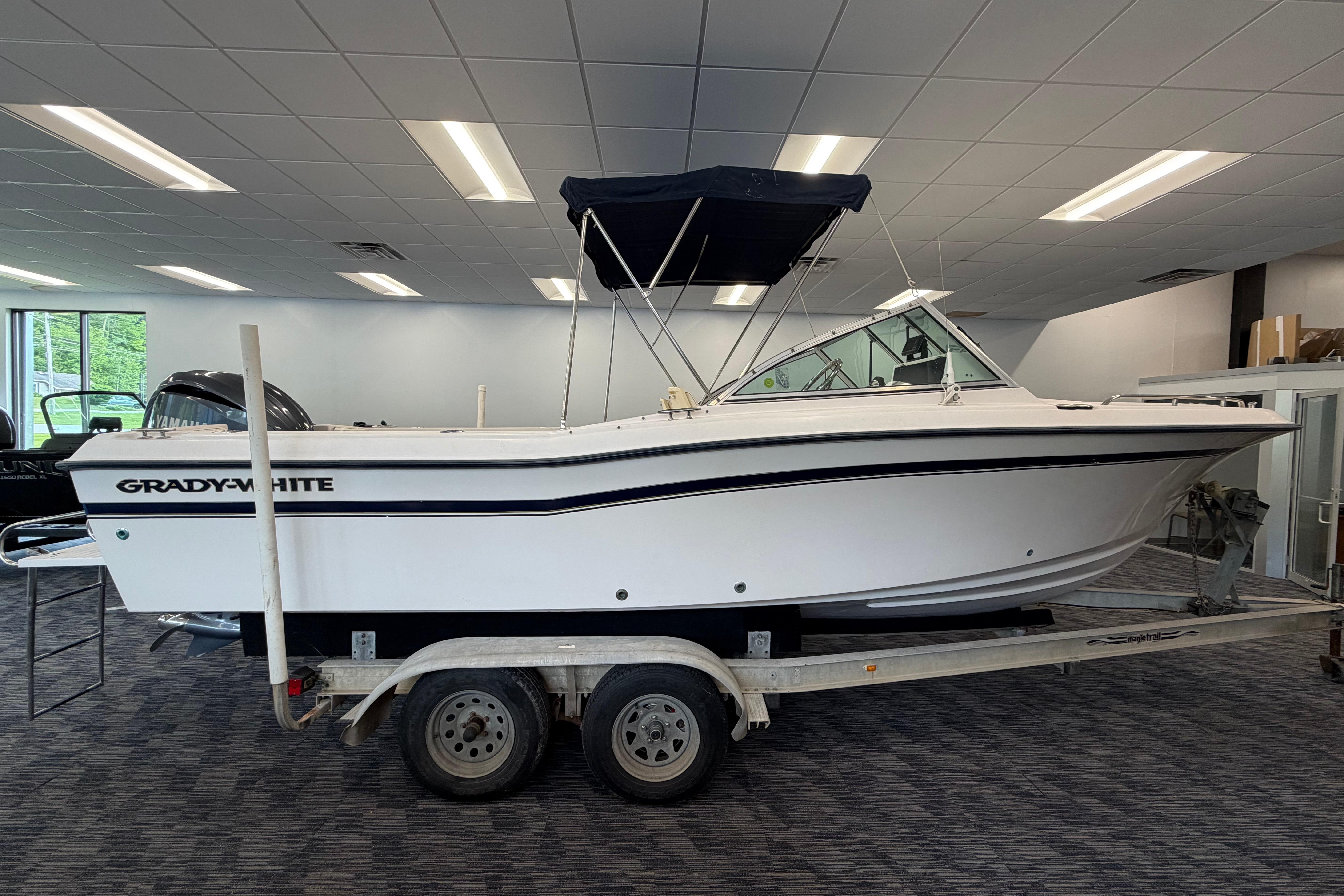 2001 Grady-White Tournament 223 boat on trailer in showroom.