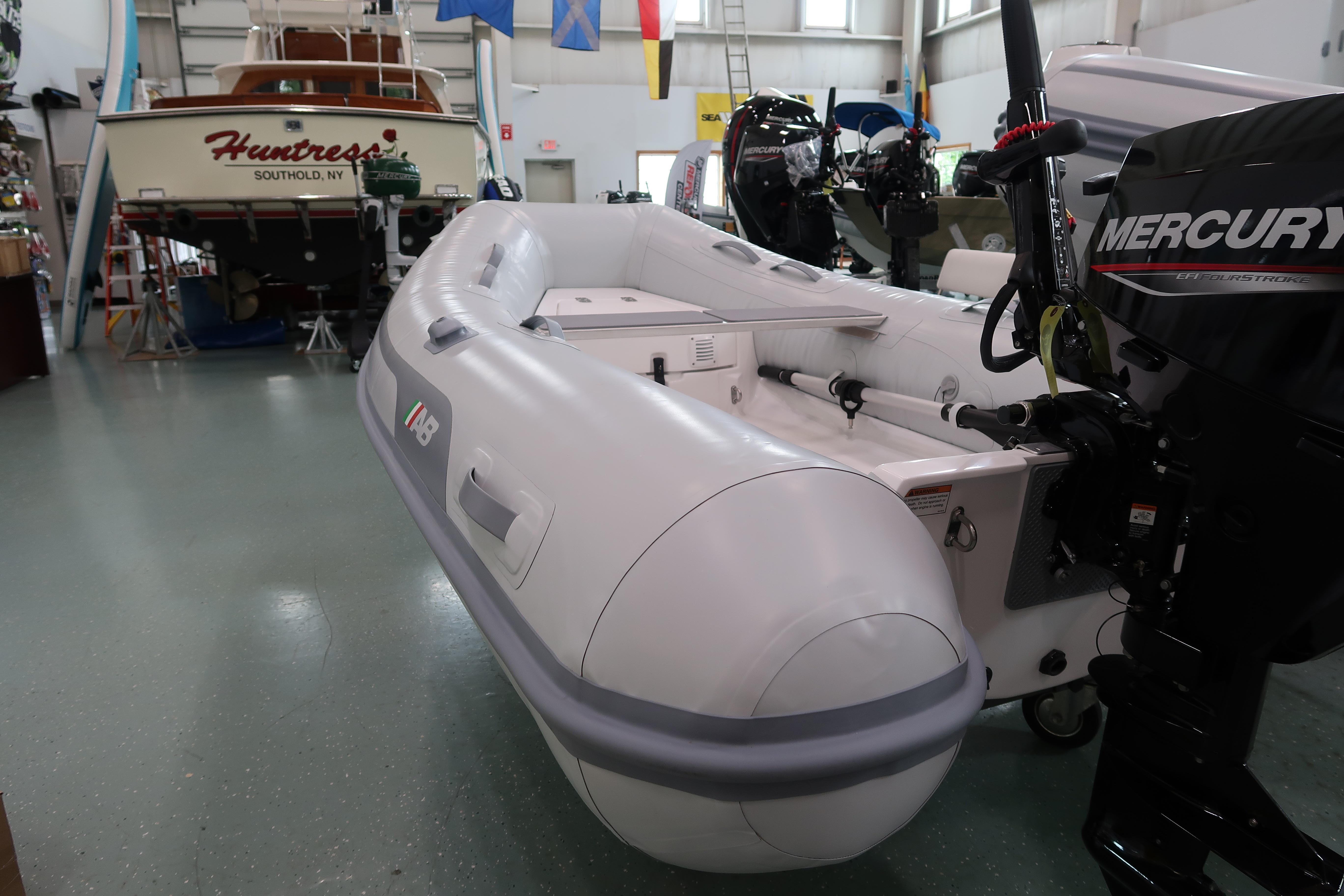 2024 AB Inflatables Navigo 9 VS boat with Mercury engine in showroom.