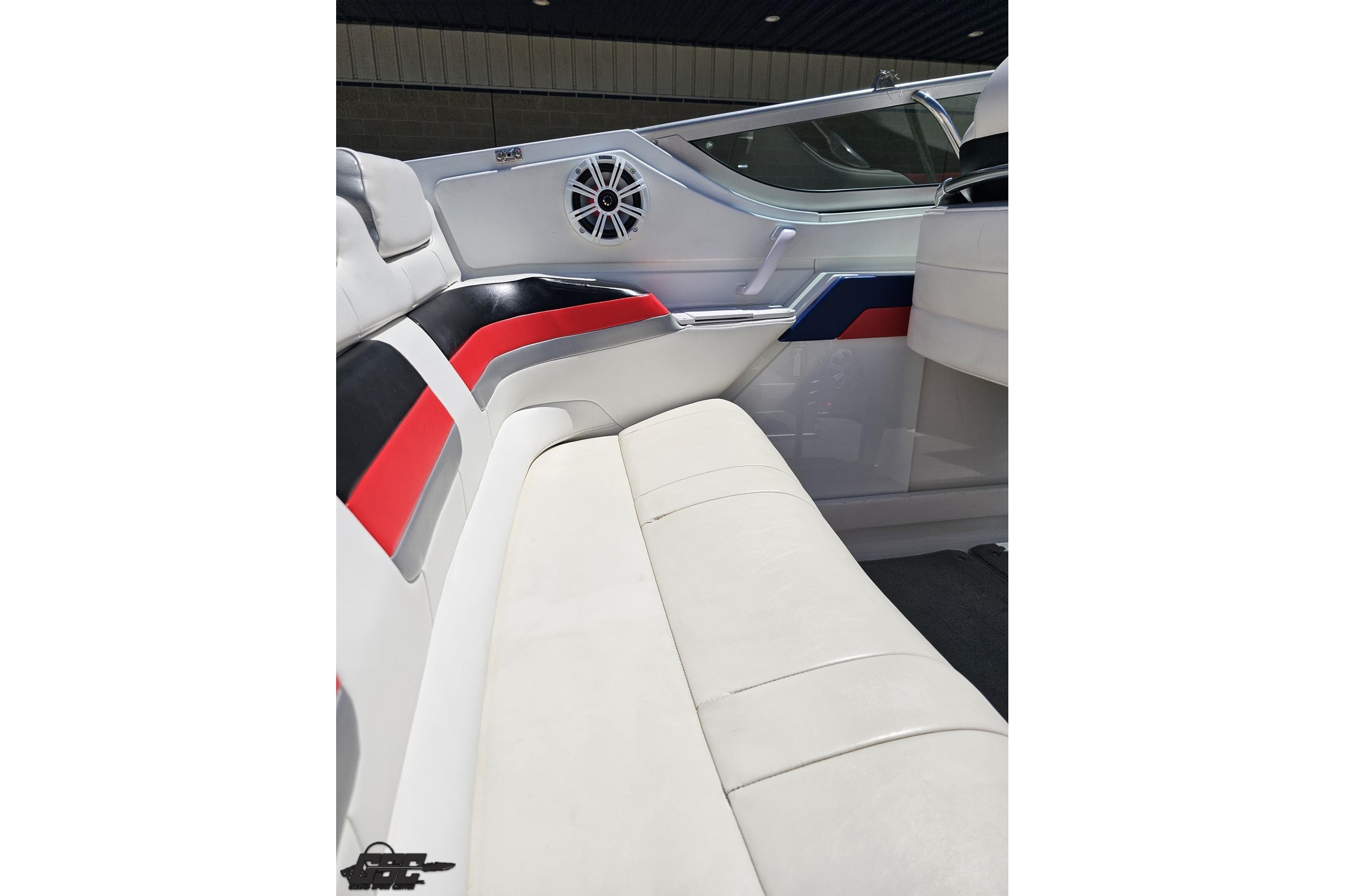 2005 Formula 271 FASTech boat interior with white, red, and black seating and speaker.