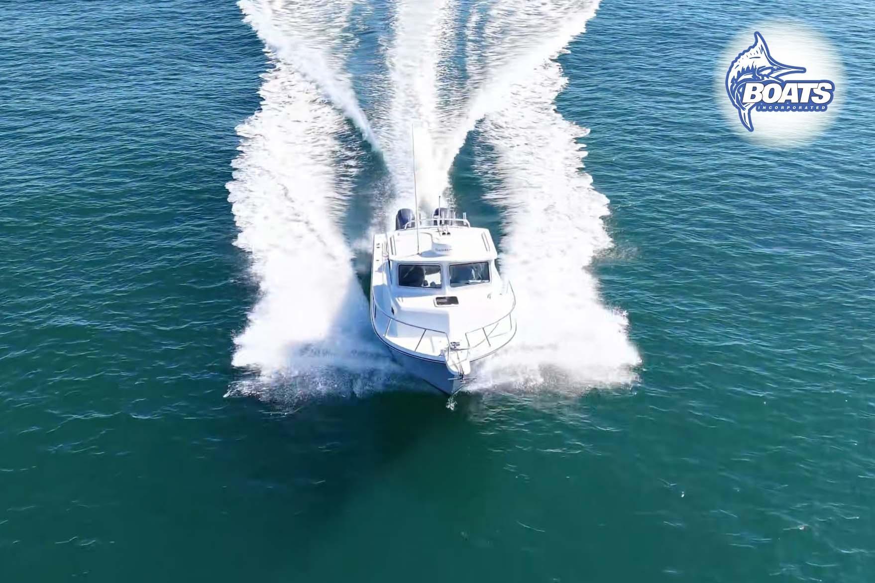 2021 Parker 2520 XLD Sport Cabin cruising on open water, aerial view.