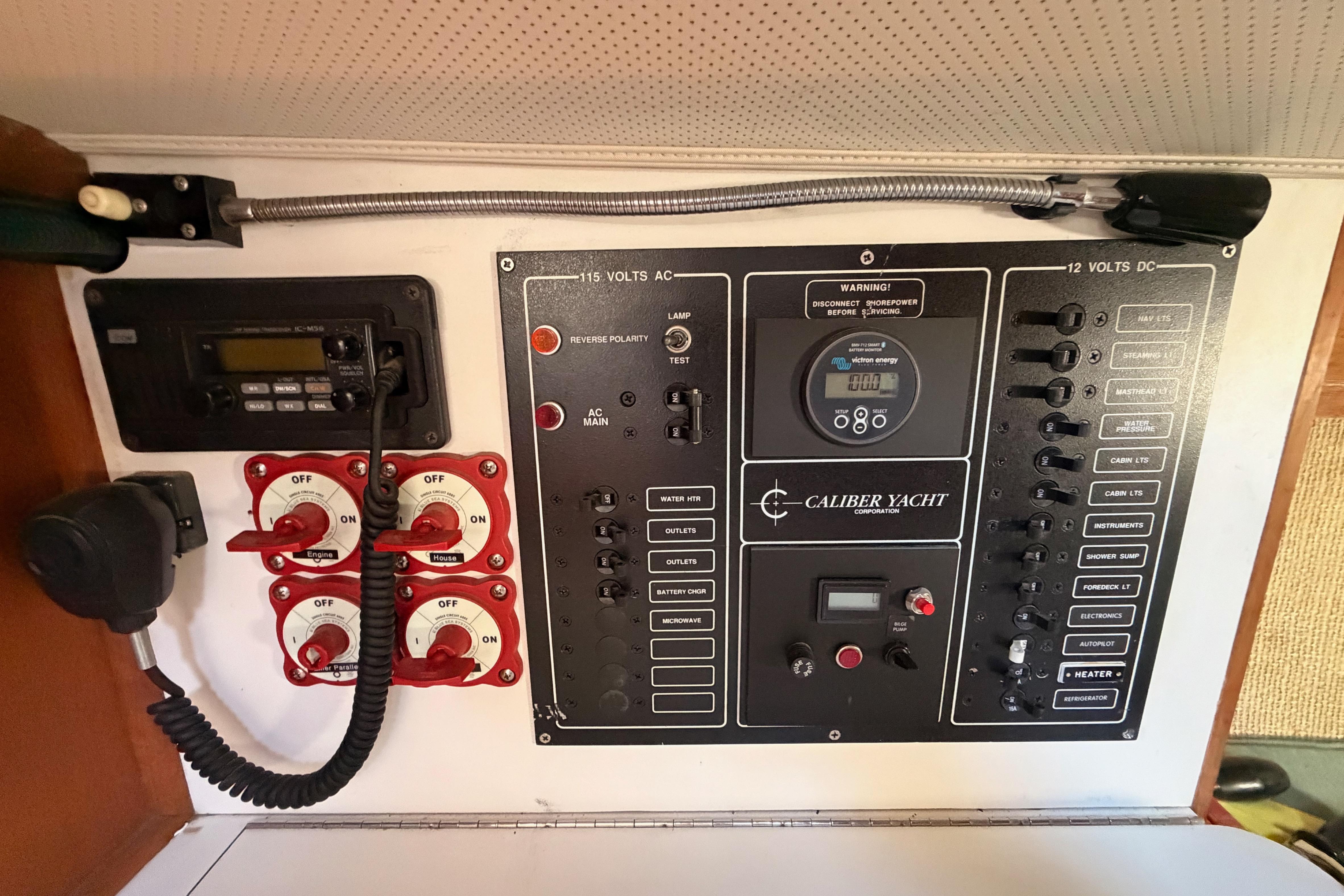 Electrical control panel of a 1991 Caliber 33 yacht, featuring switches and gauges.