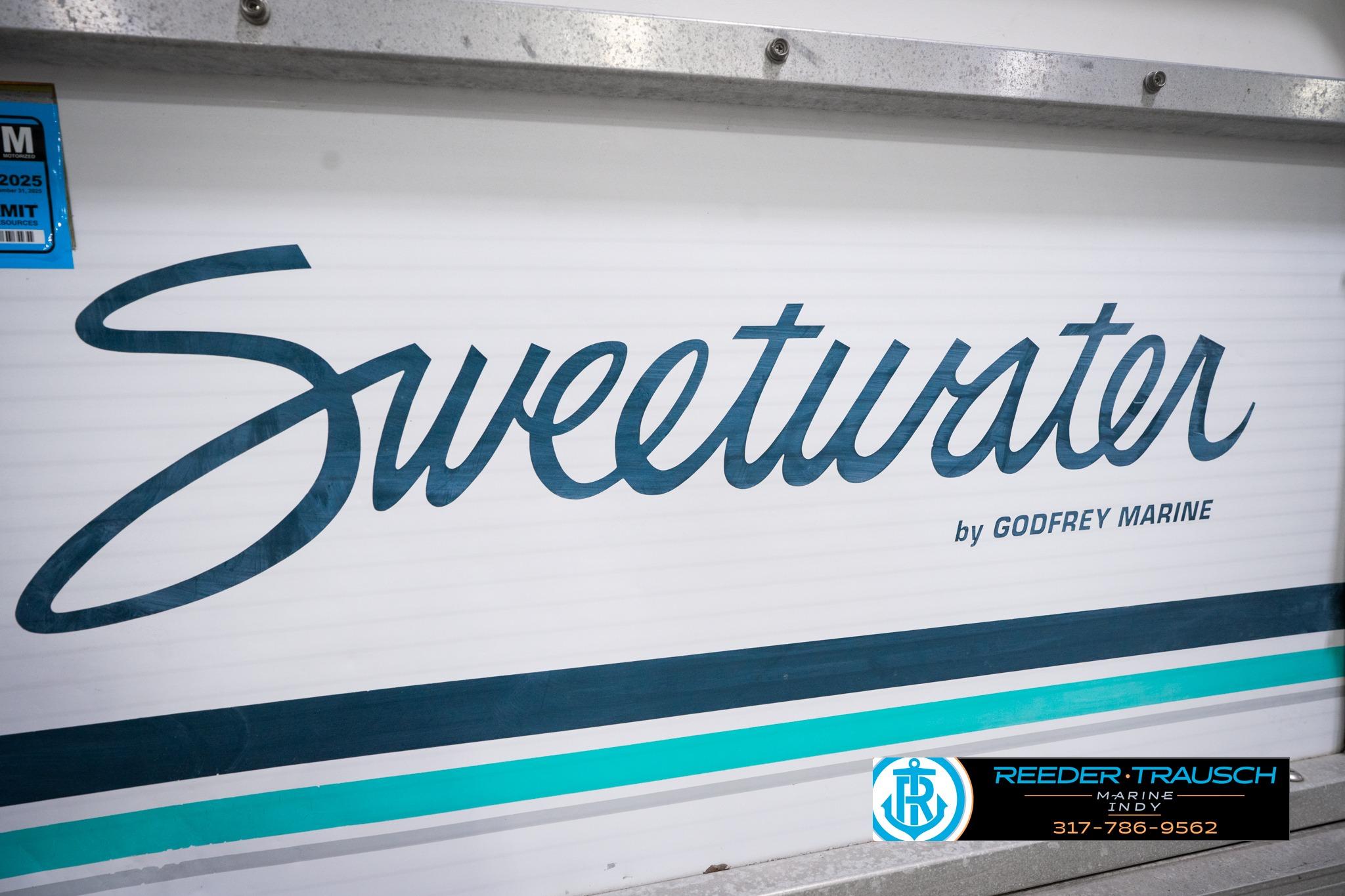 1992 Godfrey Sweetwater boat logo with teal and blue accents, Reeder-Trausch Marine branding.