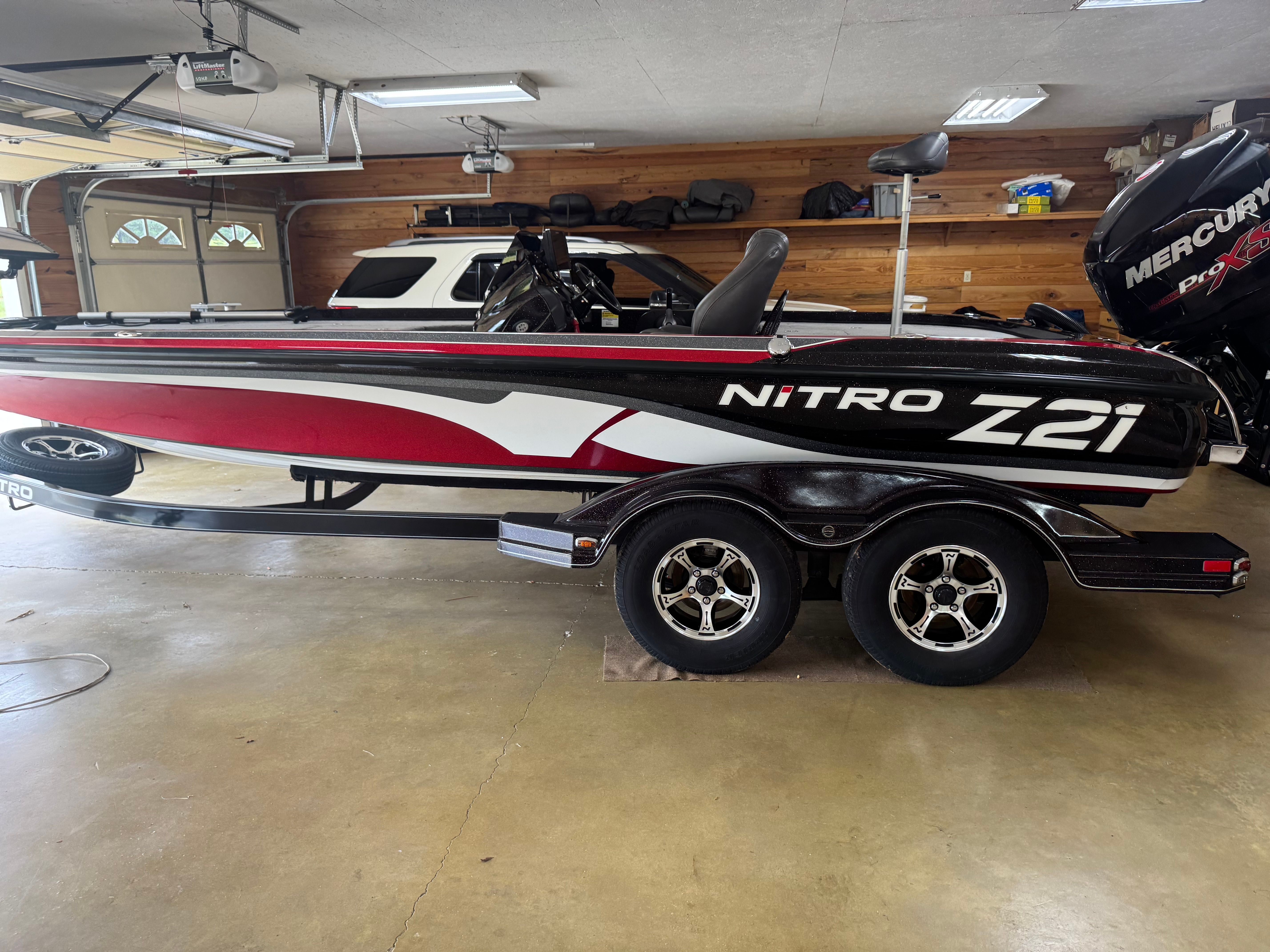 A 2016 Nitro Z21 boat is parked in a garage.