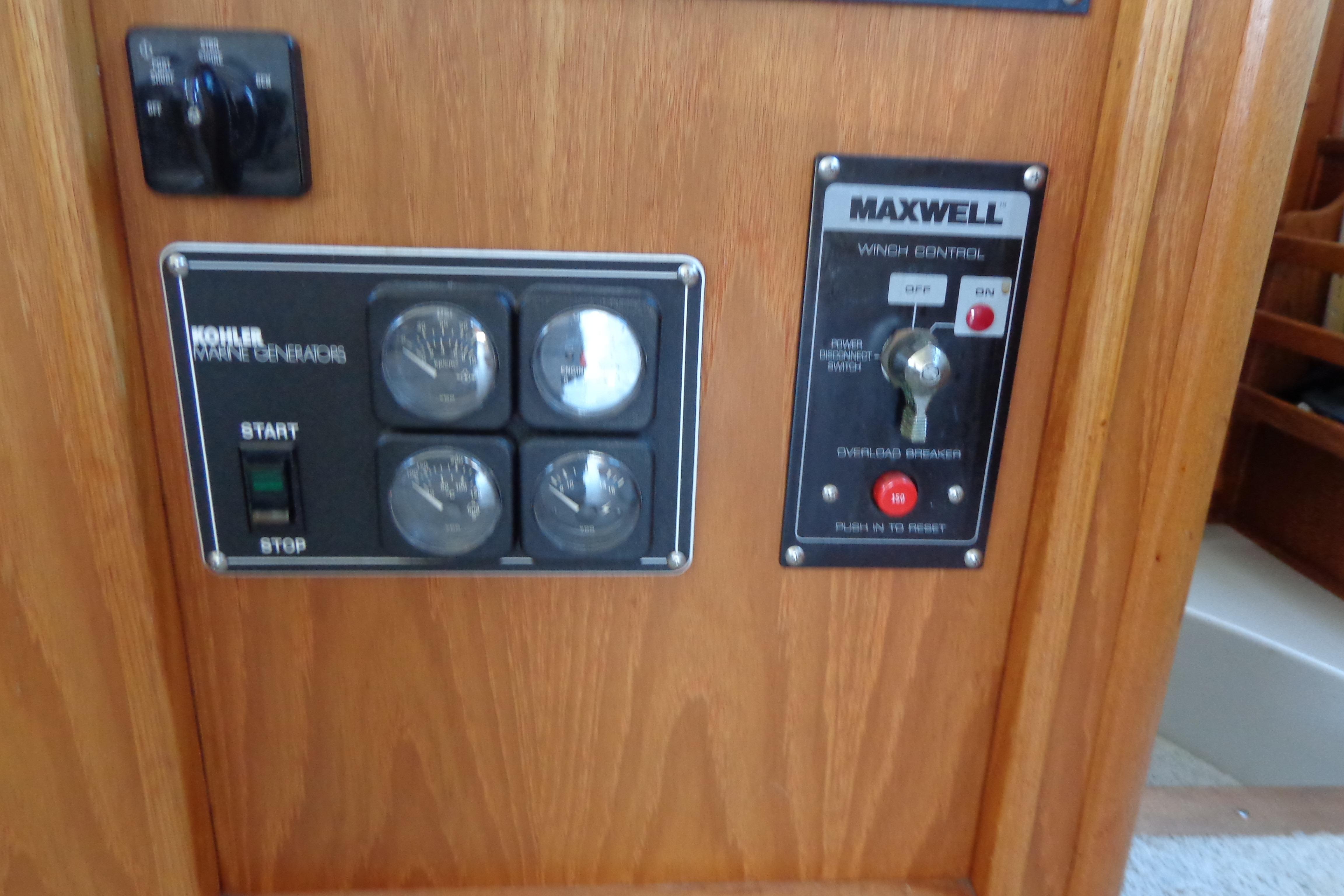 Control panel of a 1992 Cruise-A-Home Corsair 4200 with Kohler marine generator and Maxwell winch.