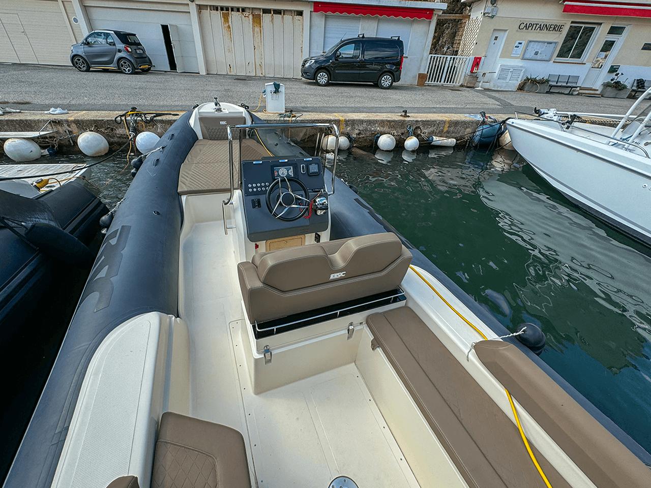 2019 BSC 78 boat docked, featuring a sleek design and modern steering console.