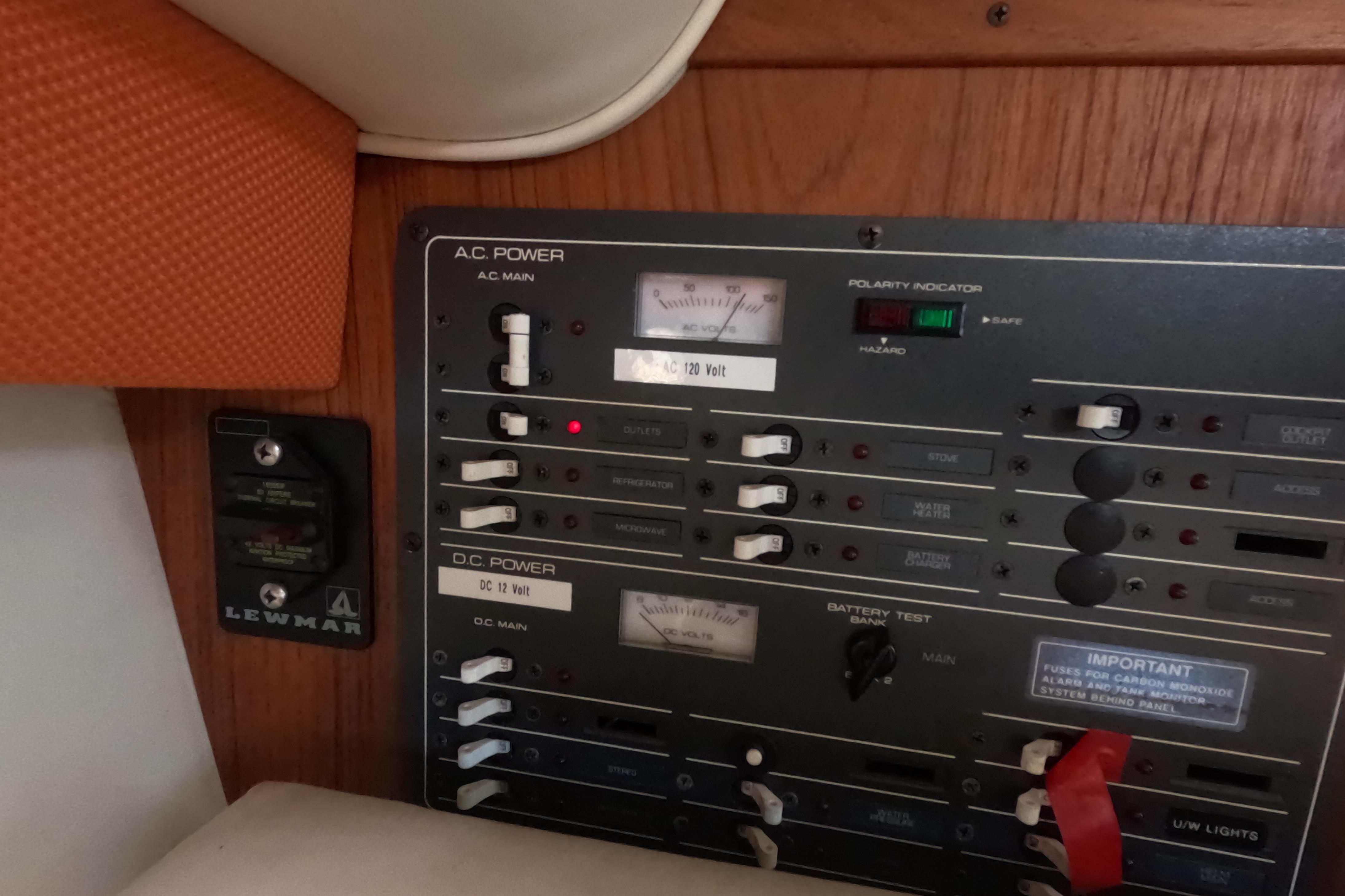 Control panel of a 1995 Tiara Yachts 2900 Open, featuring AC and DC power switches.