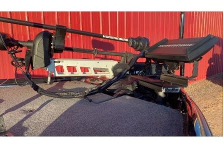 2020 Bass Cat Eyra Premium boat with Humminbird equipment, red background.