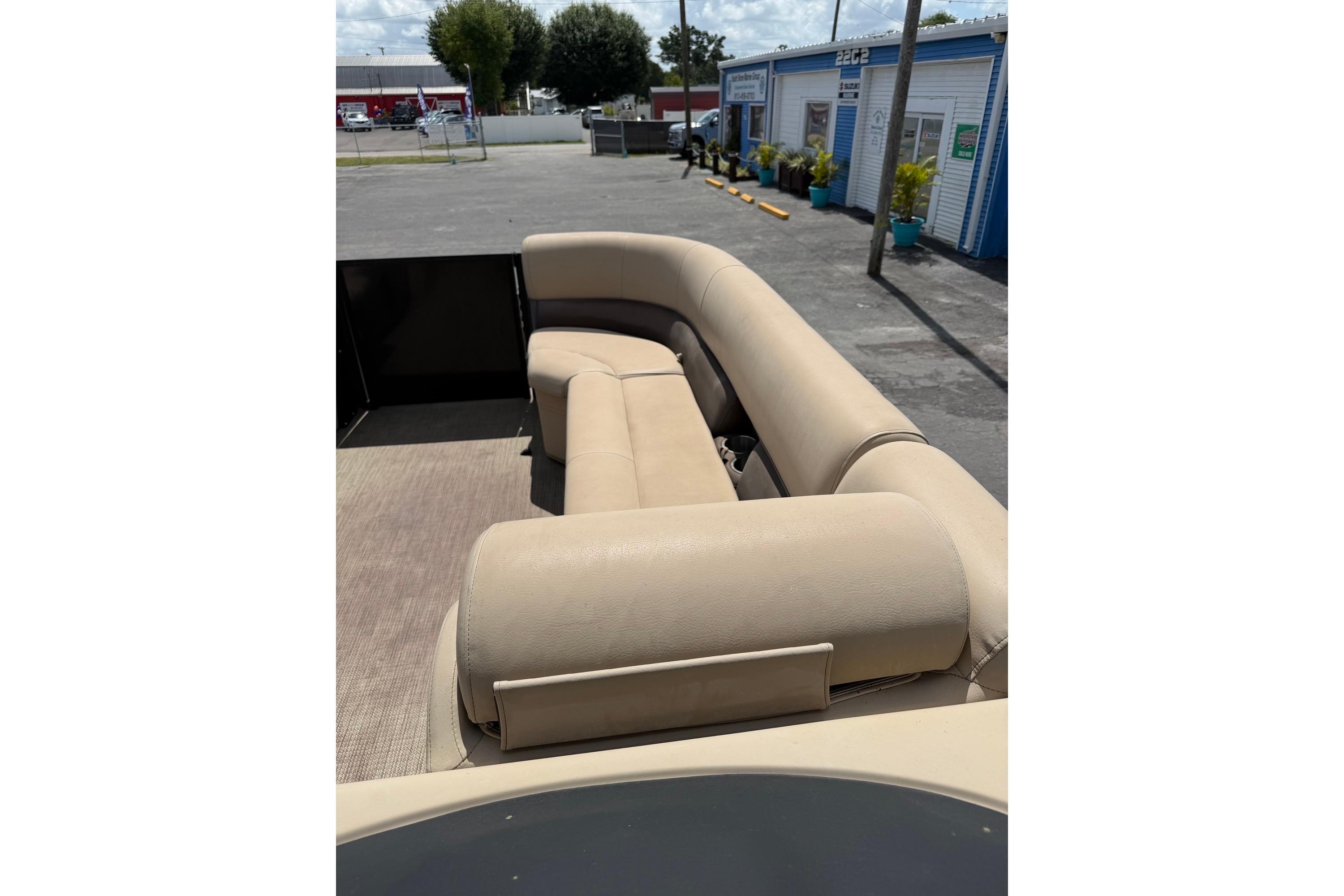 2022 Bentley Pontoons 240 CRUISE with beige seating, parked outdoors.