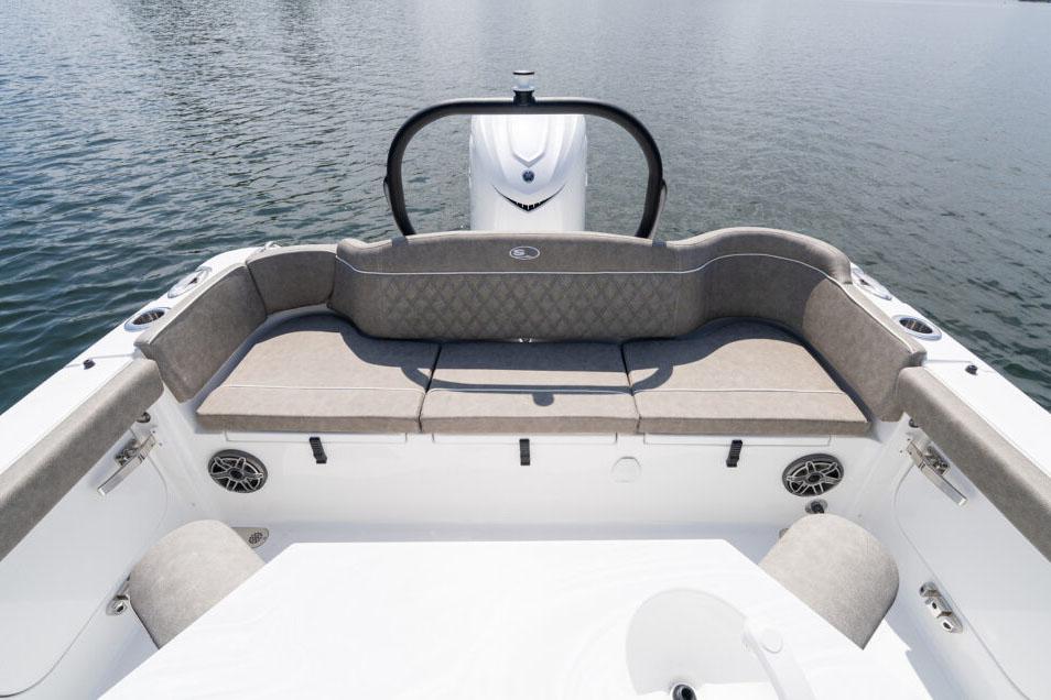 Manufacturer Provided Image: 2026 Sea Hunt Ultra 255 SE boat interior with cushioned seating and water backdrop.