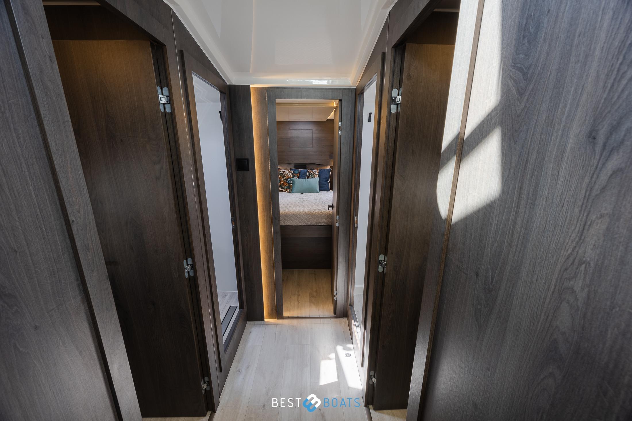 Interior hallway of 2023 Cobra Yachts Futura 36 Premium Fly, featuring modern wood finishes.