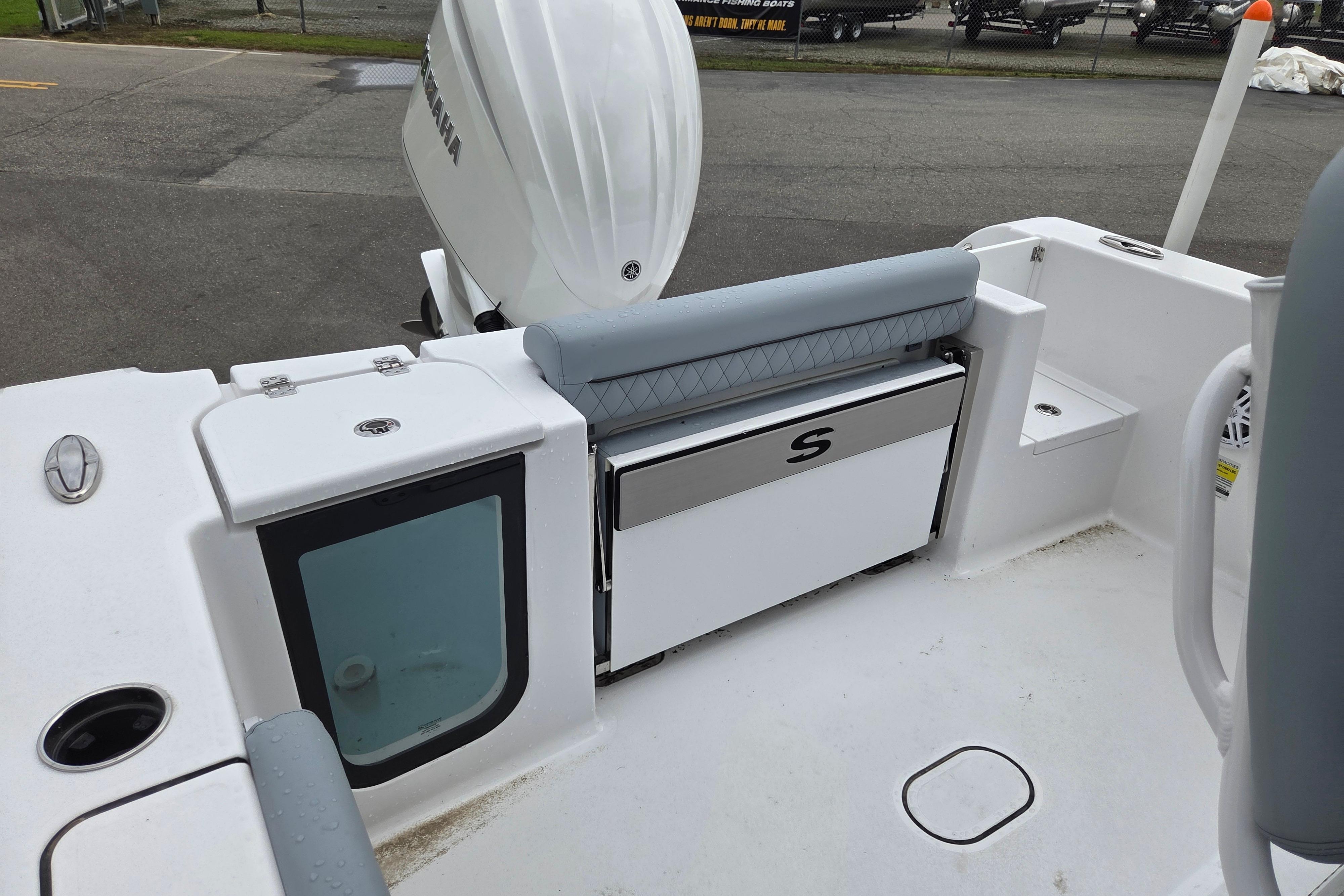 2026 Sportsman Open 232 Center Console boat interior with seating and storage.