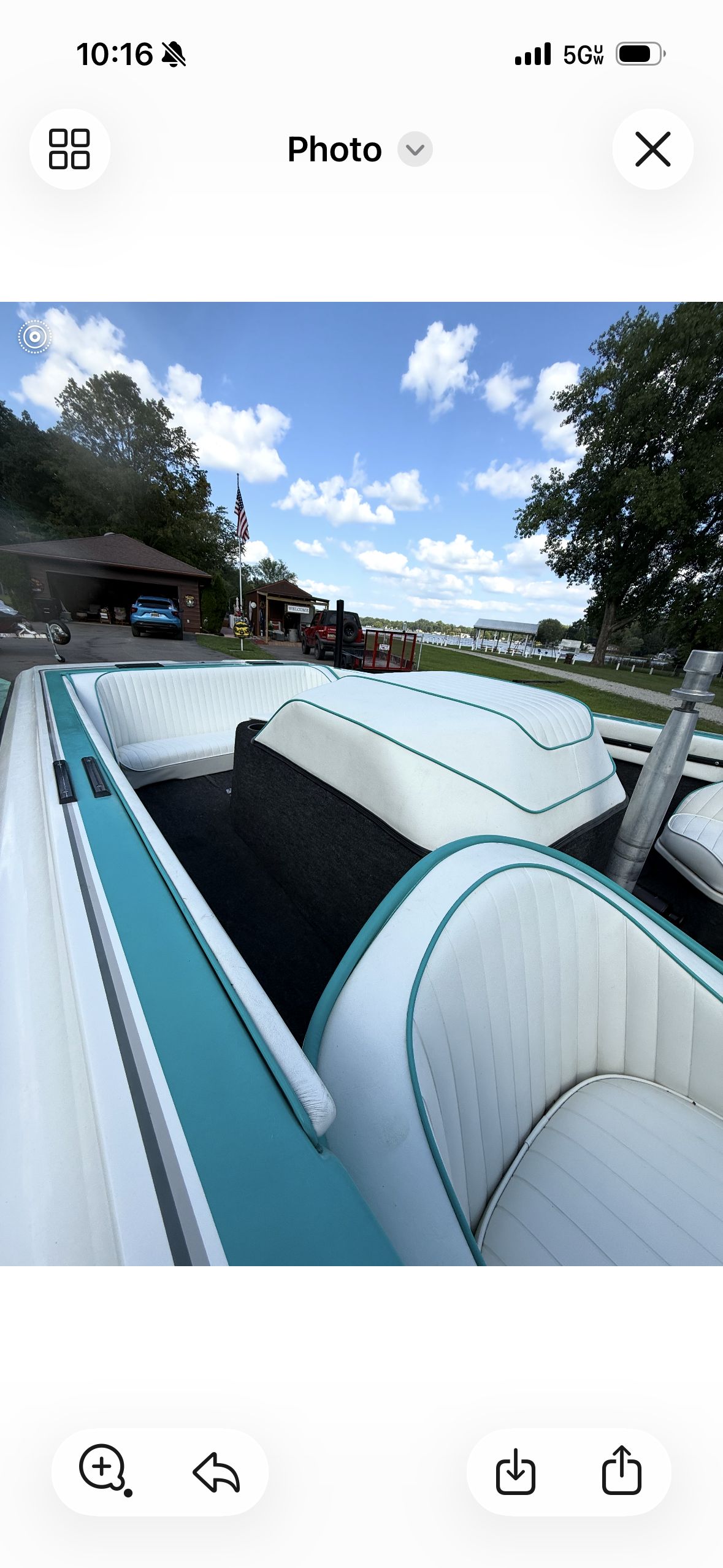 Interior view of a 1992 Malibu Skier with white and turquoise seats.