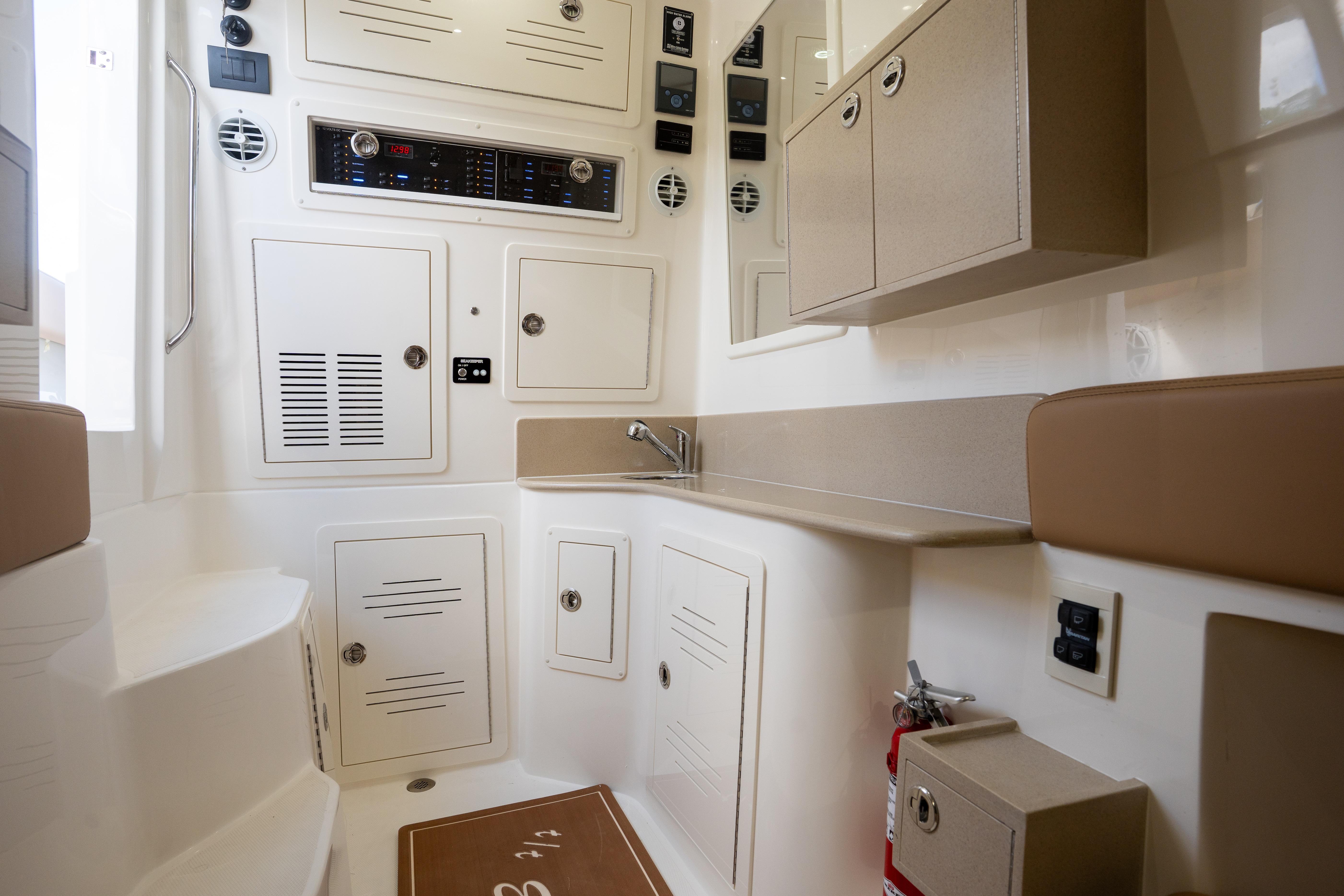Interior of 2026 Blackwater 41 Performance Fish boat, featuring cabinetry and control panels.