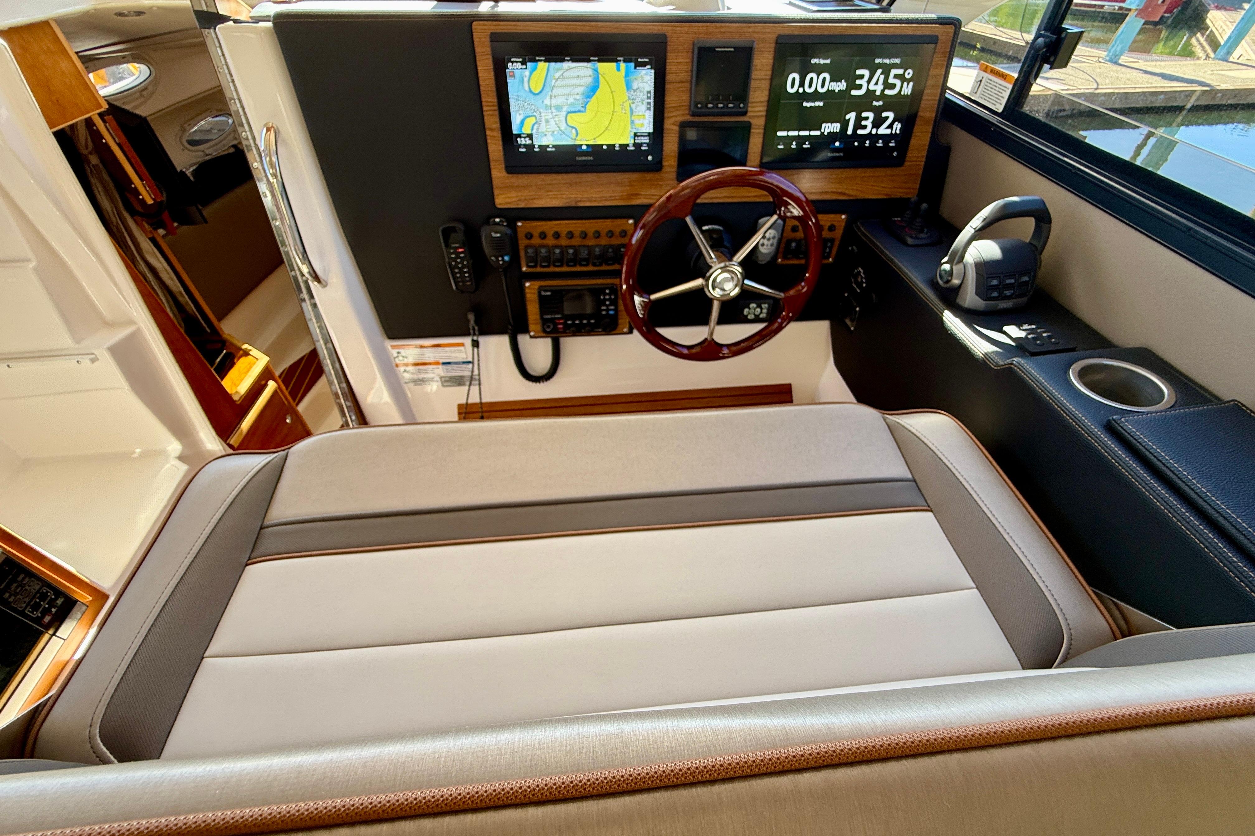 2023 Cutwater C-30 Sedan helm with modern navigation displays and luxurious seating.