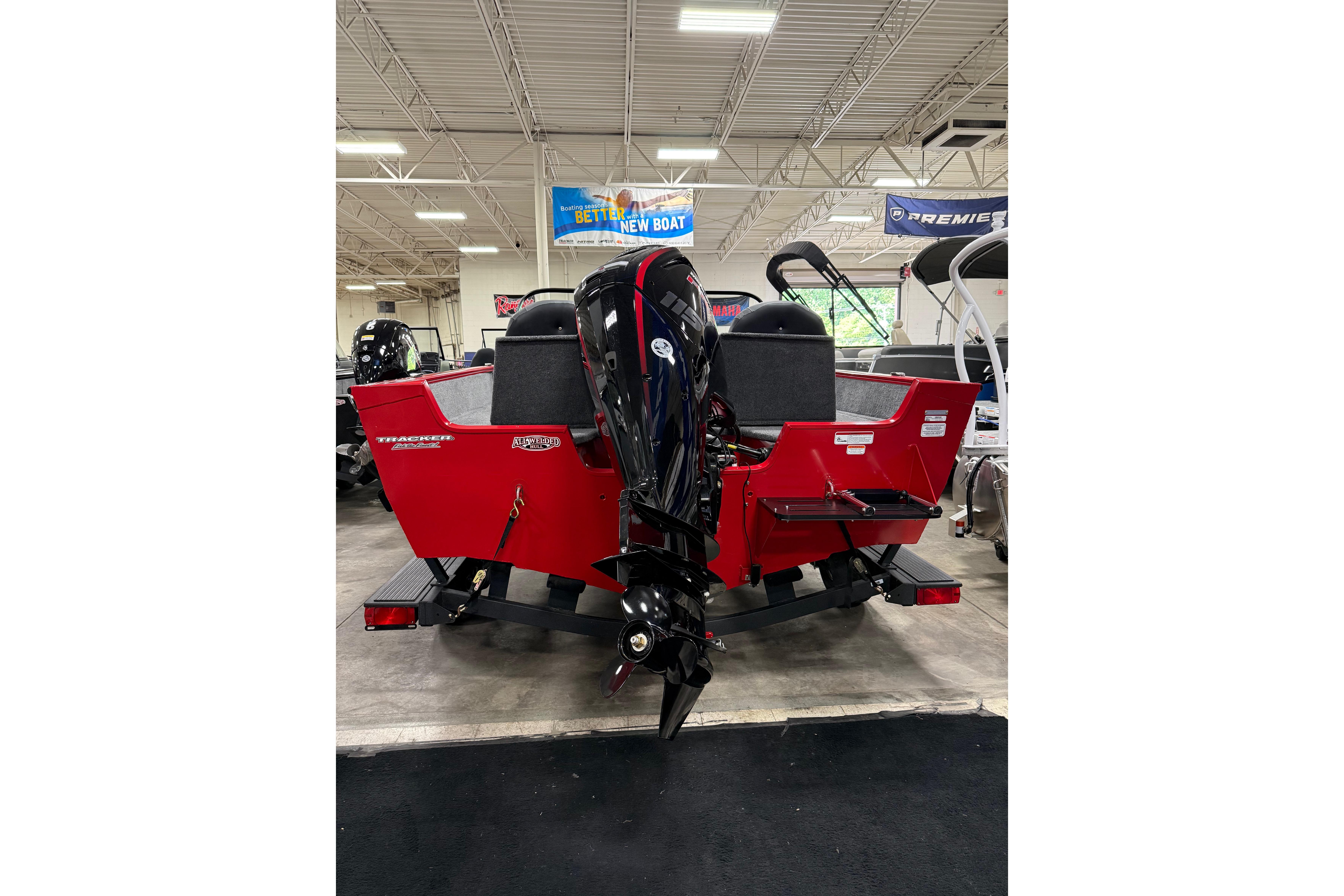 2026 Tracker Pro Guide V-175 Combo boat, red exterior, displayed indoors.