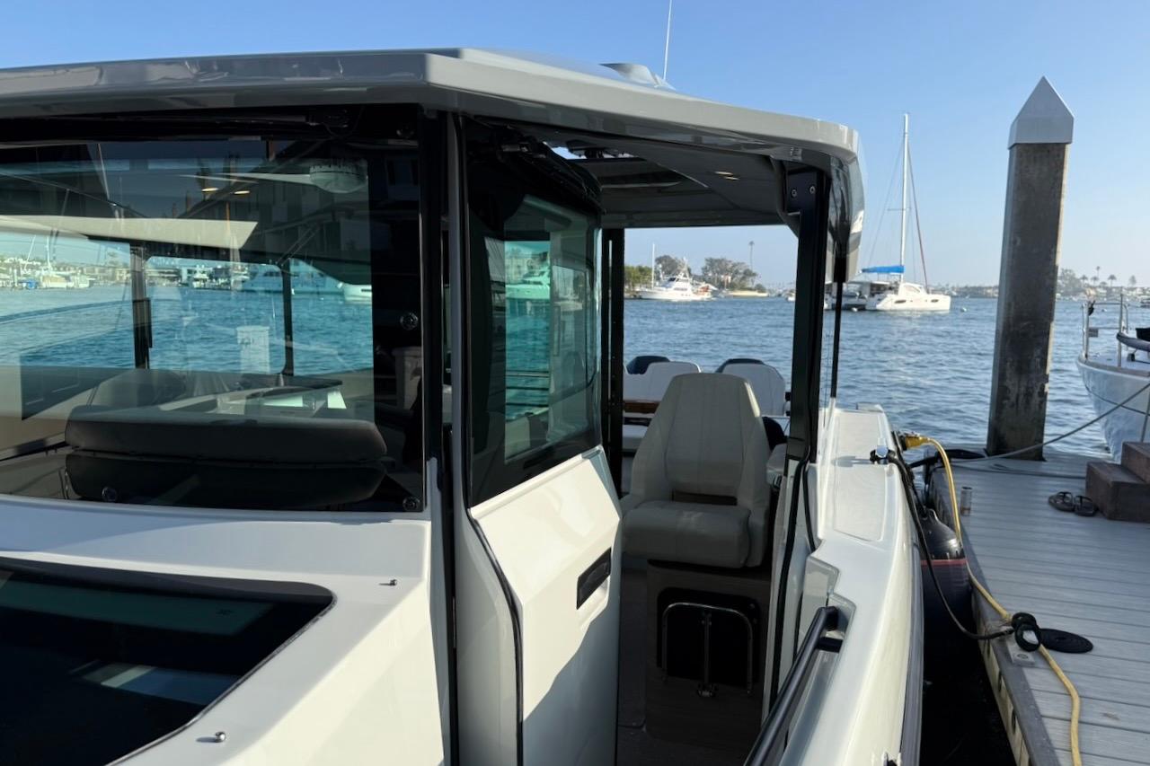 2024 Saxdor 320 GTC boat docked, showcasing sleek design and modern features.