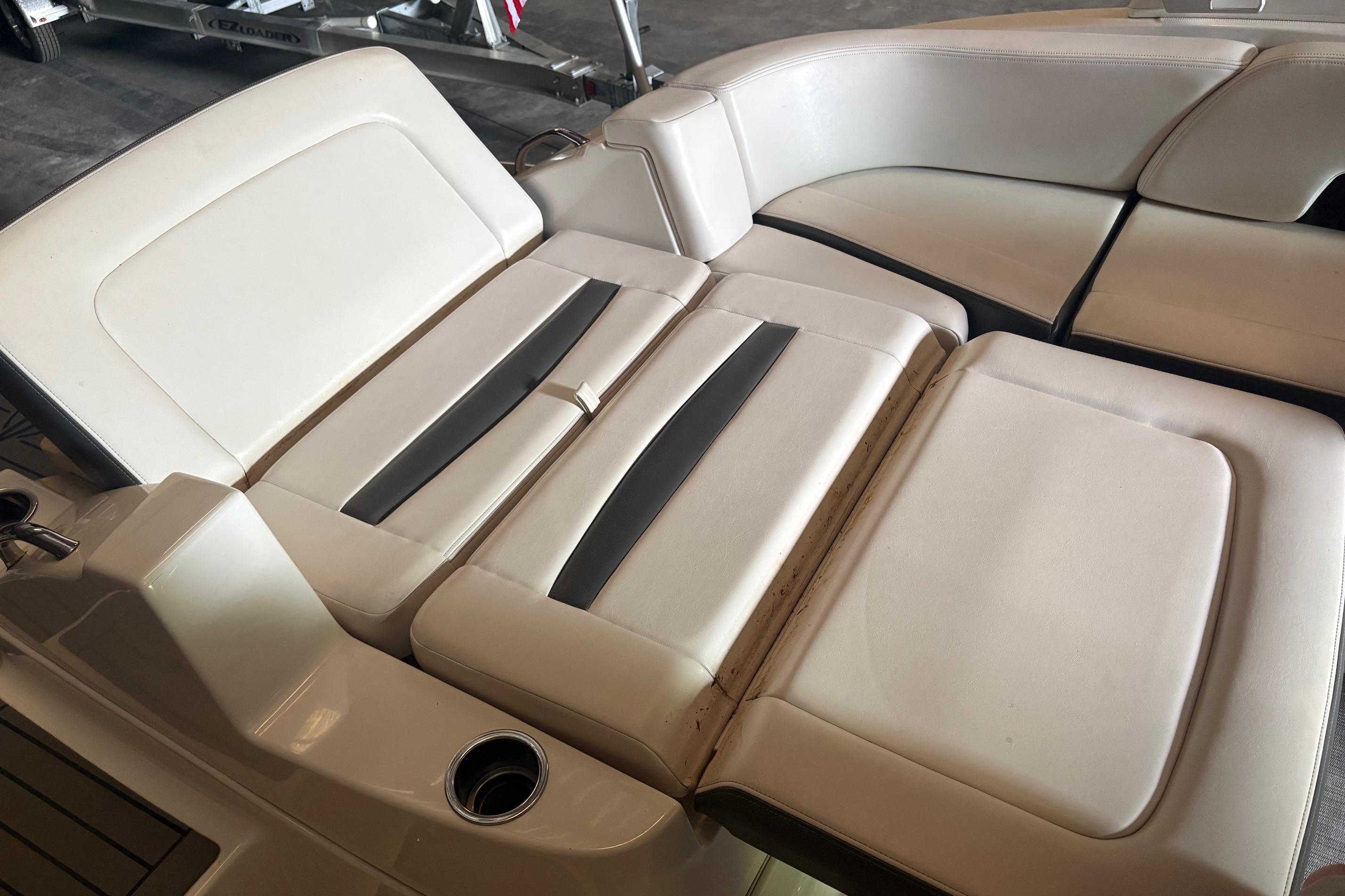 2016 Chaparral 244 Sunesta boat interior seating with white and black upholstery.